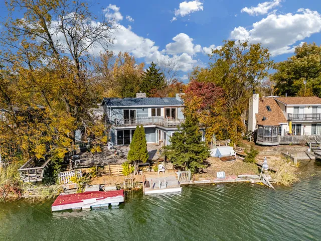 an aerial view of residential houses with outdoor space