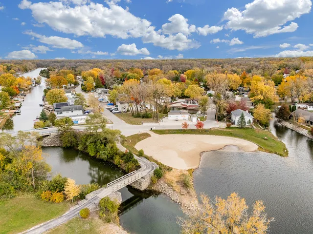 a view of a swimming pool with a yard