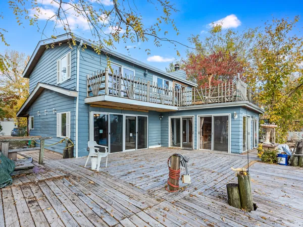 a front view of house with yard outdoor seating and barbeque oven