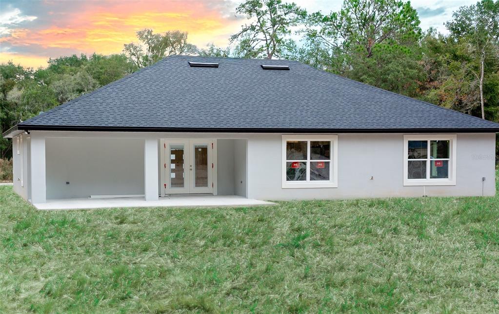 16645 Southwest 59th Court Road Ocala, FL 34473 - Photo 16 of 16 a house that has a lot of plants in it