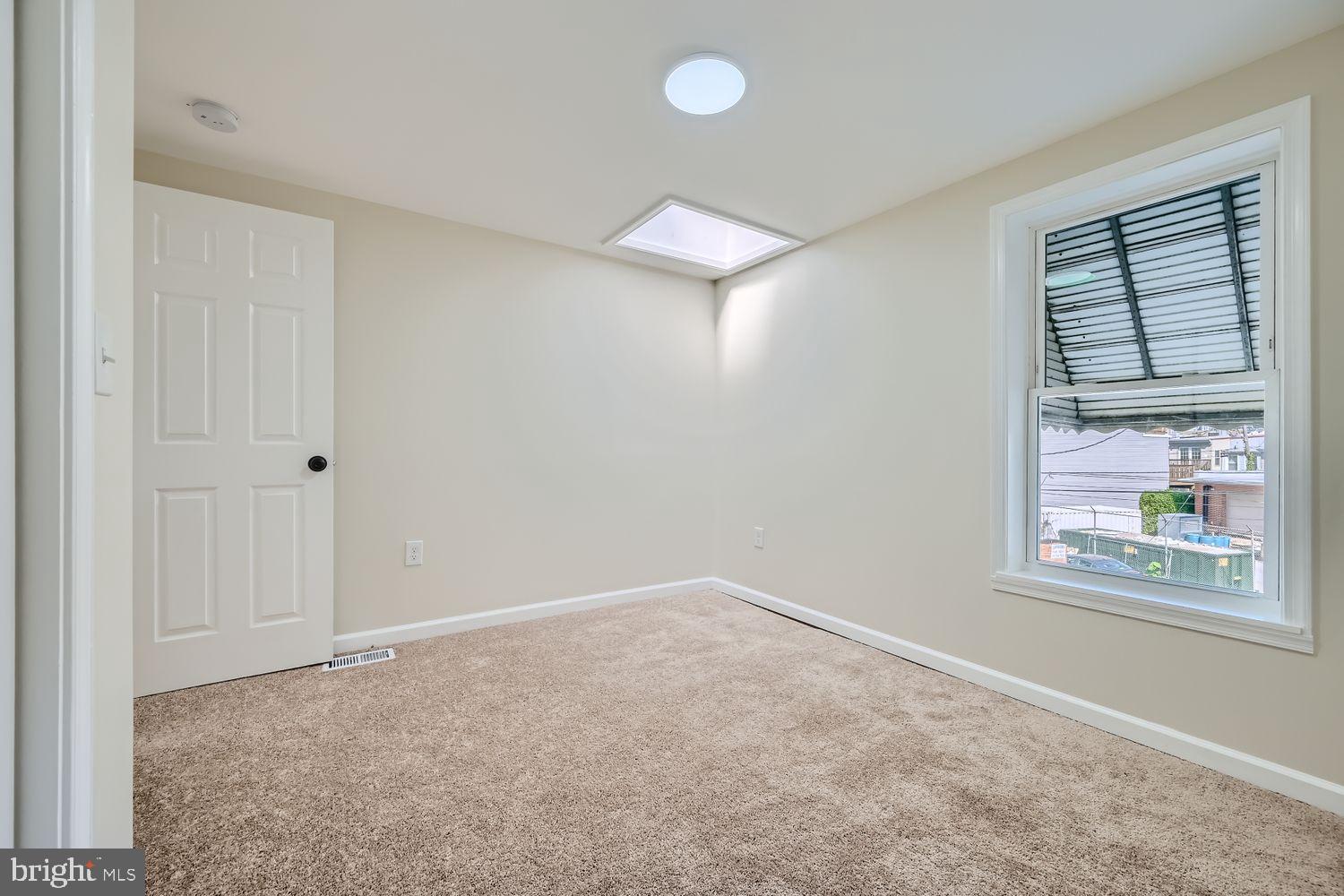 1147 Scott Street Baltimore, MD 21230 - Photo 19 of 28 an empty room with windows and closet