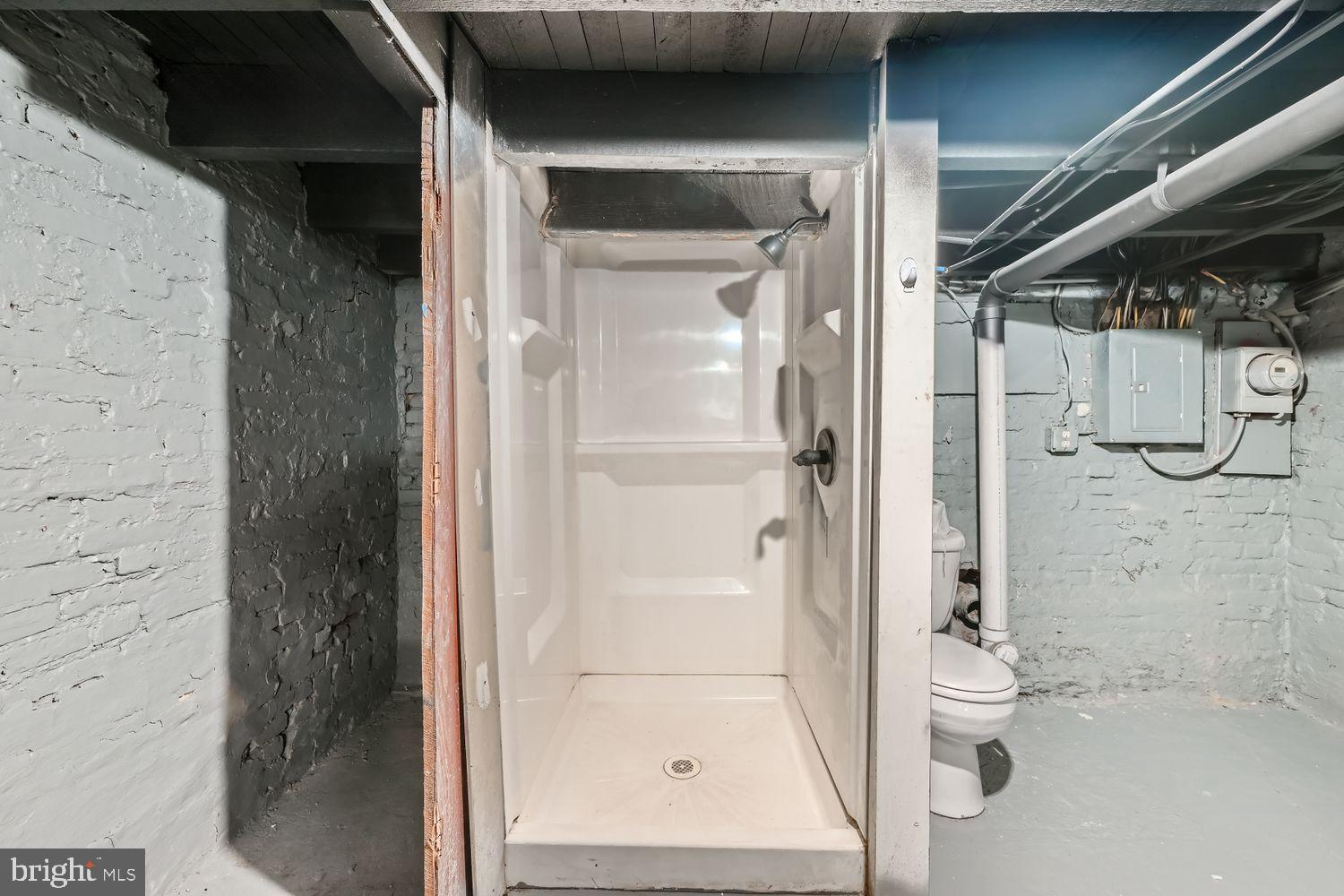 1147 Scott Street Baltimore, MD 21230 - Photo 23 of 28 a bathroom with a glass shower door