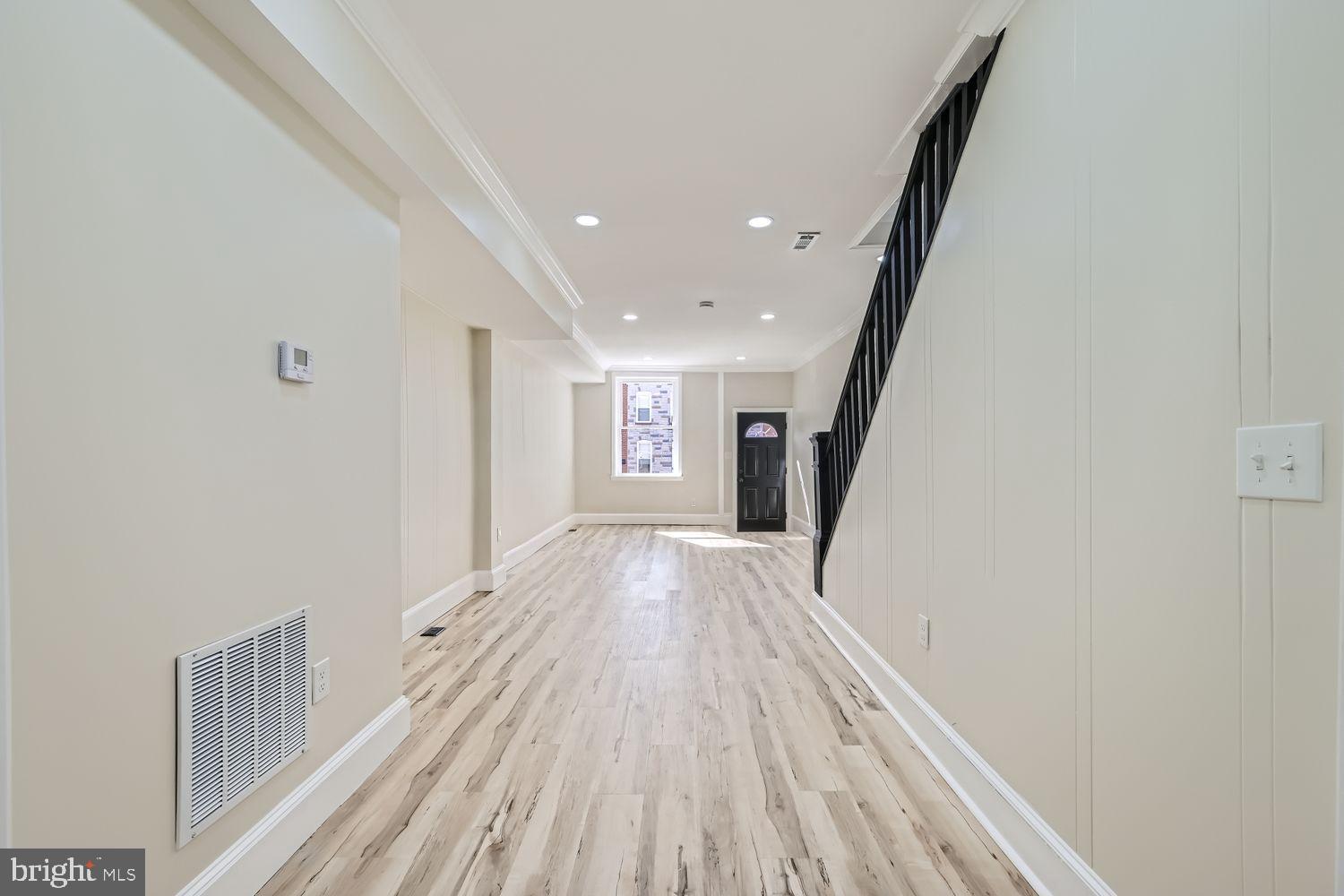 1147 Scott Street Baltimore, MD 21230 - Photo 8 of 28 a view of a hallway with wooden floor