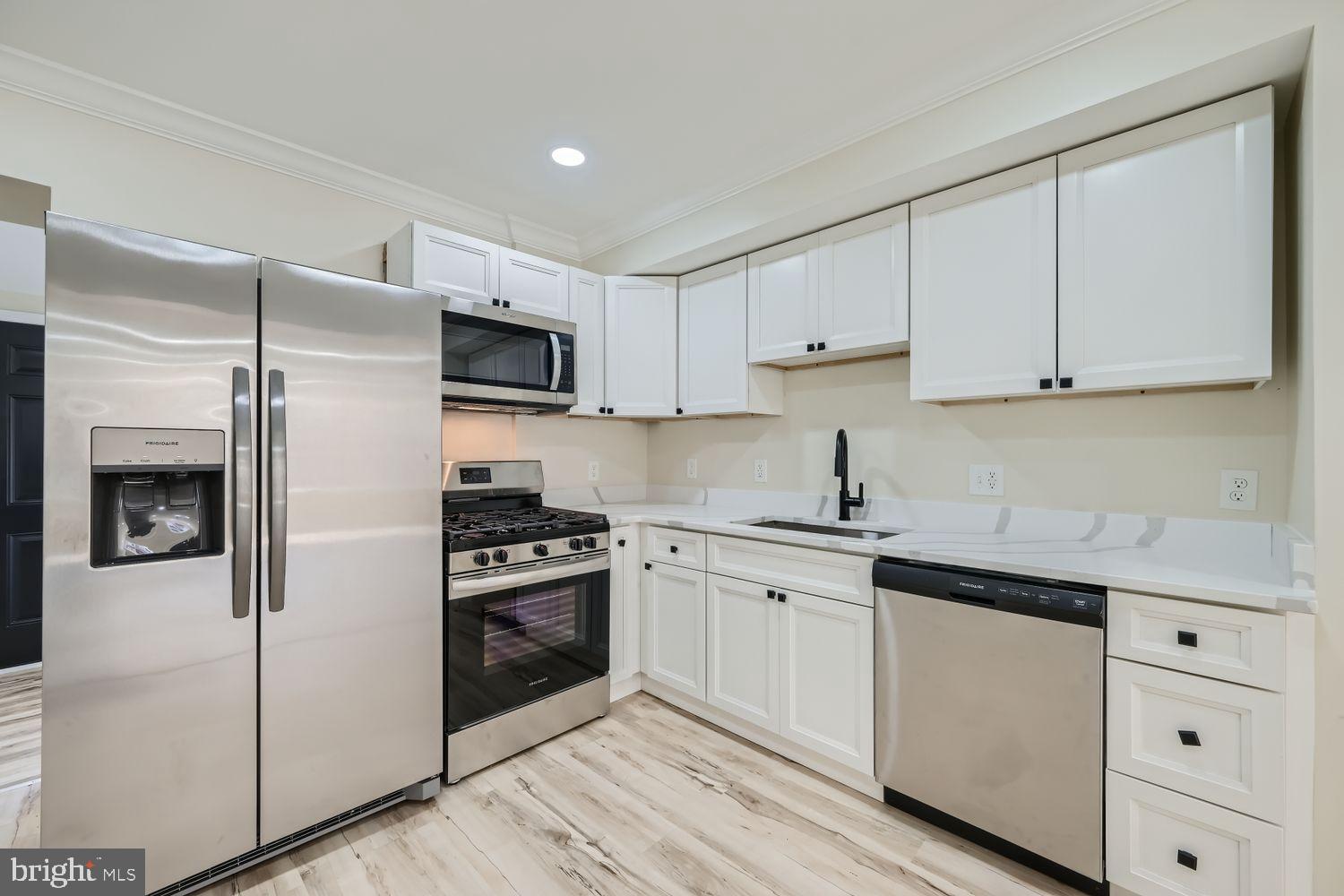 1147 Scott Street Baltimore, MD 21230 - Photo 10 of 28 a kitchen with cabinets stainless steel appliances and a counter space