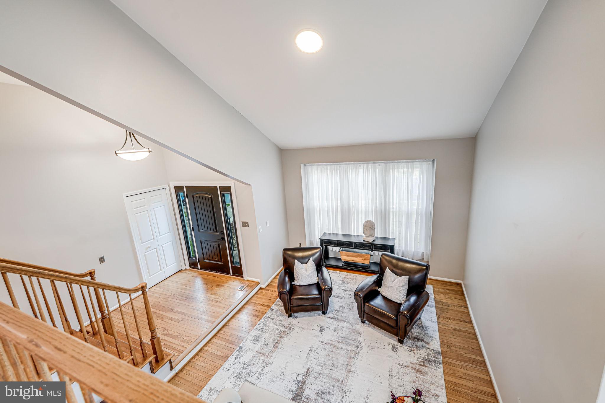107 Country Road Sterling, VA 20165 - Photo 12 of 58 a living room with furniture rug and a window