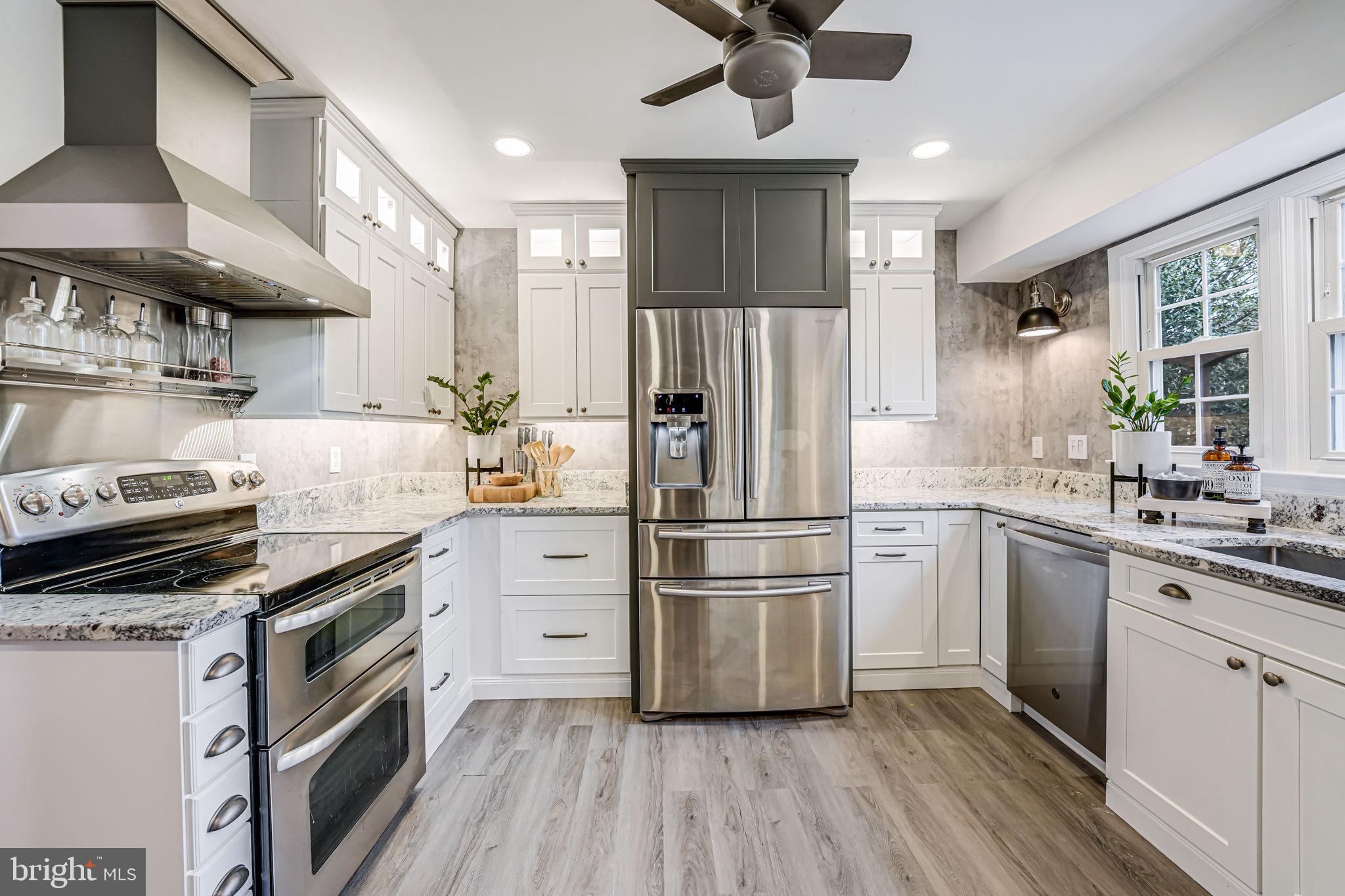 107 Country Road Sterling, VA 20165 - Photo 15 of 58 a kitchen with a stove a refrigerator and a sink