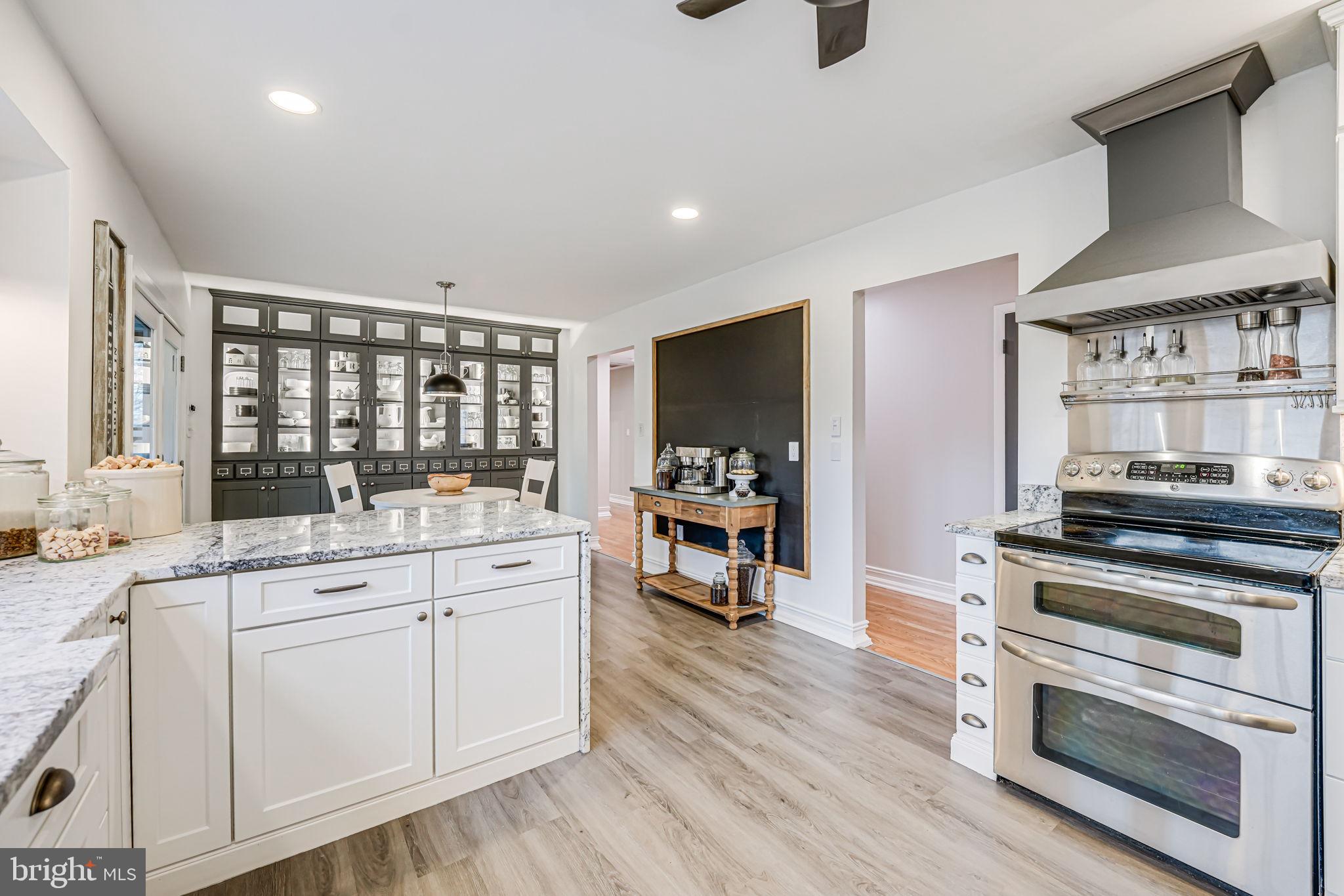 107 Country Road Sterling, VA 20165 - Photo 16 of 58 a kitchen with a stove a sink and a refrigerator