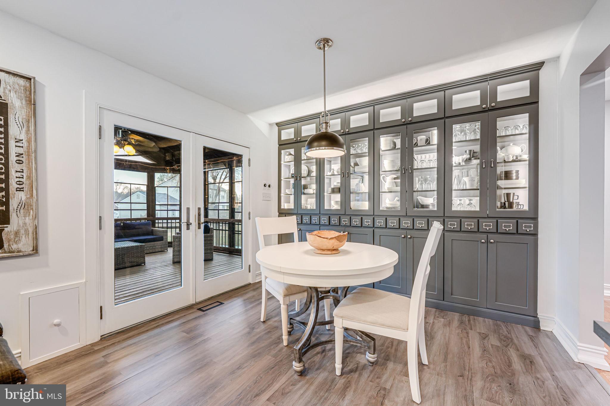 107 Country Road Sterling, VA 20165 - Photo 19 of 58 a view of a dining room with furniture window and wooden floor