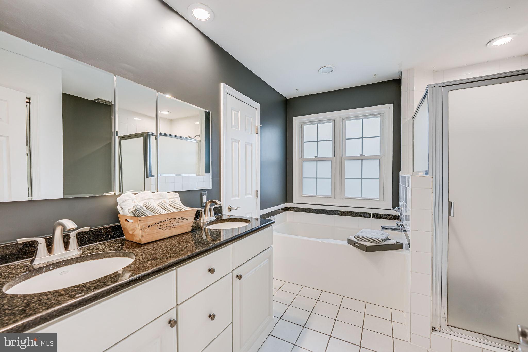 107 Country Road Sterling, VA 20165 - Photo 26 of 58 a spacious bathroom with sinks mirror and double