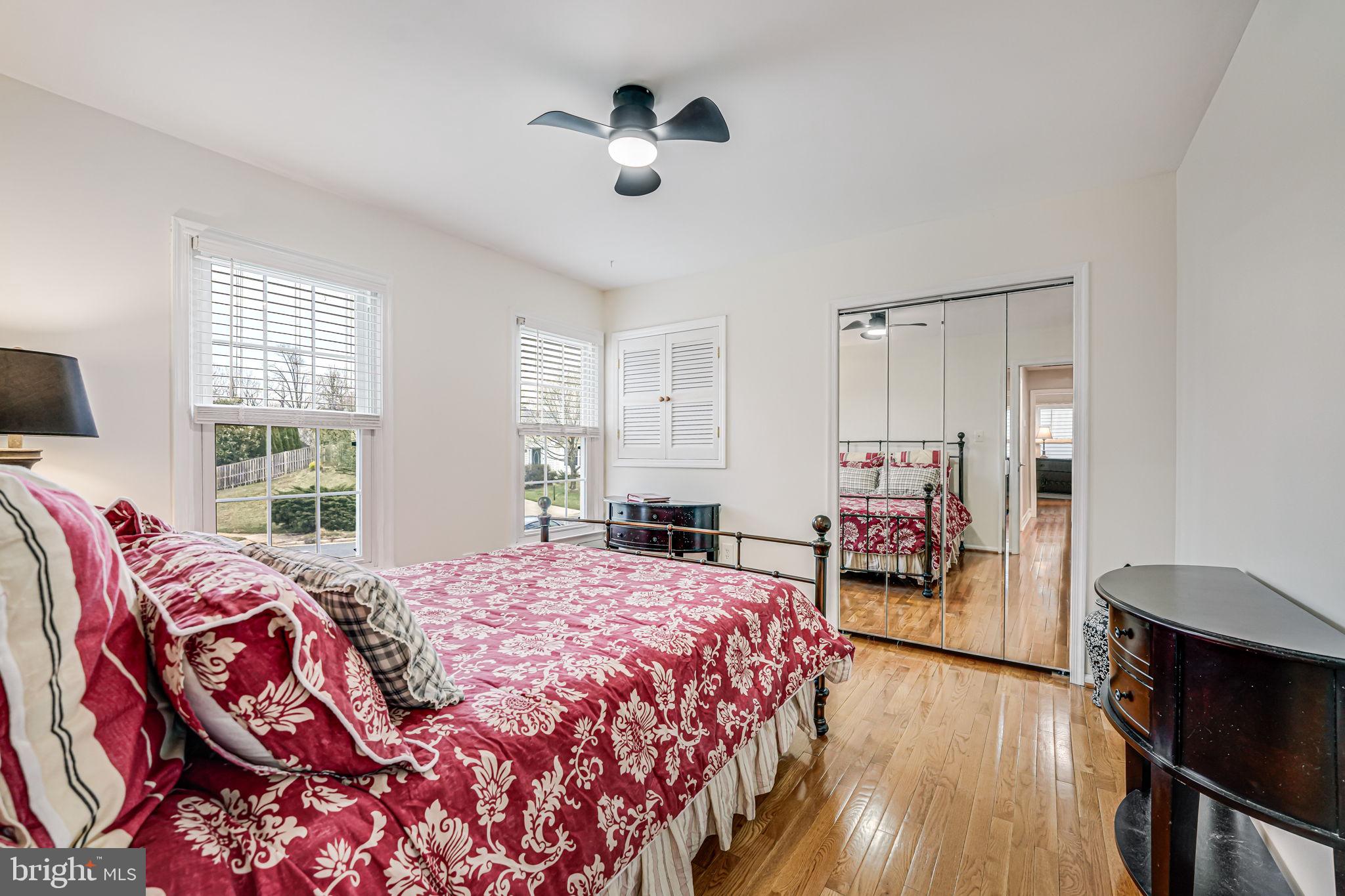 107 Country Road Sterling, VA 20165 - Photo 28 of 58 a bedroom with a bed and wooden floor