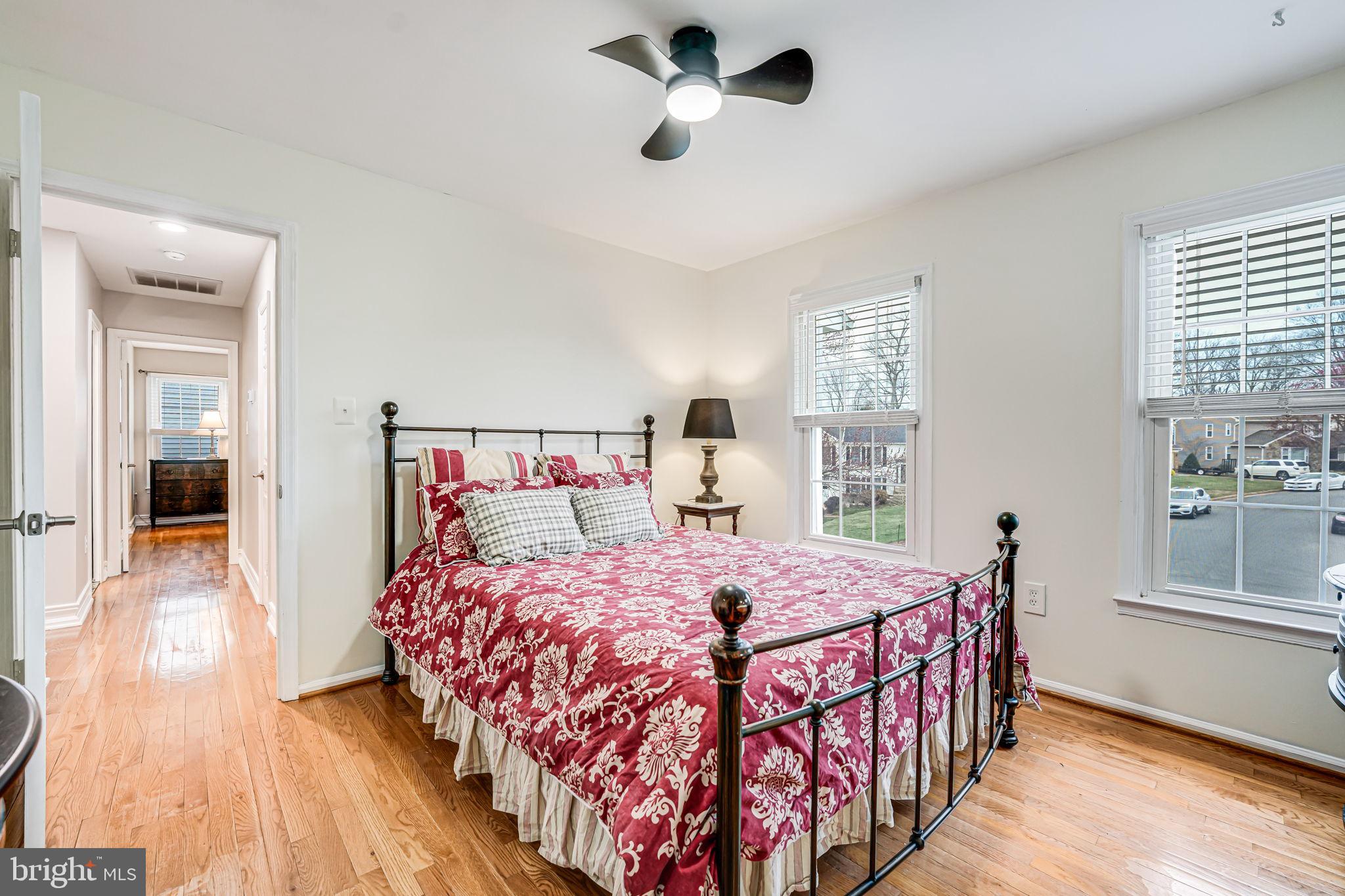 107 Country Road Sterling, VA 20165 - Photo 29 of 58 a bedroom with a bed and wooden floor