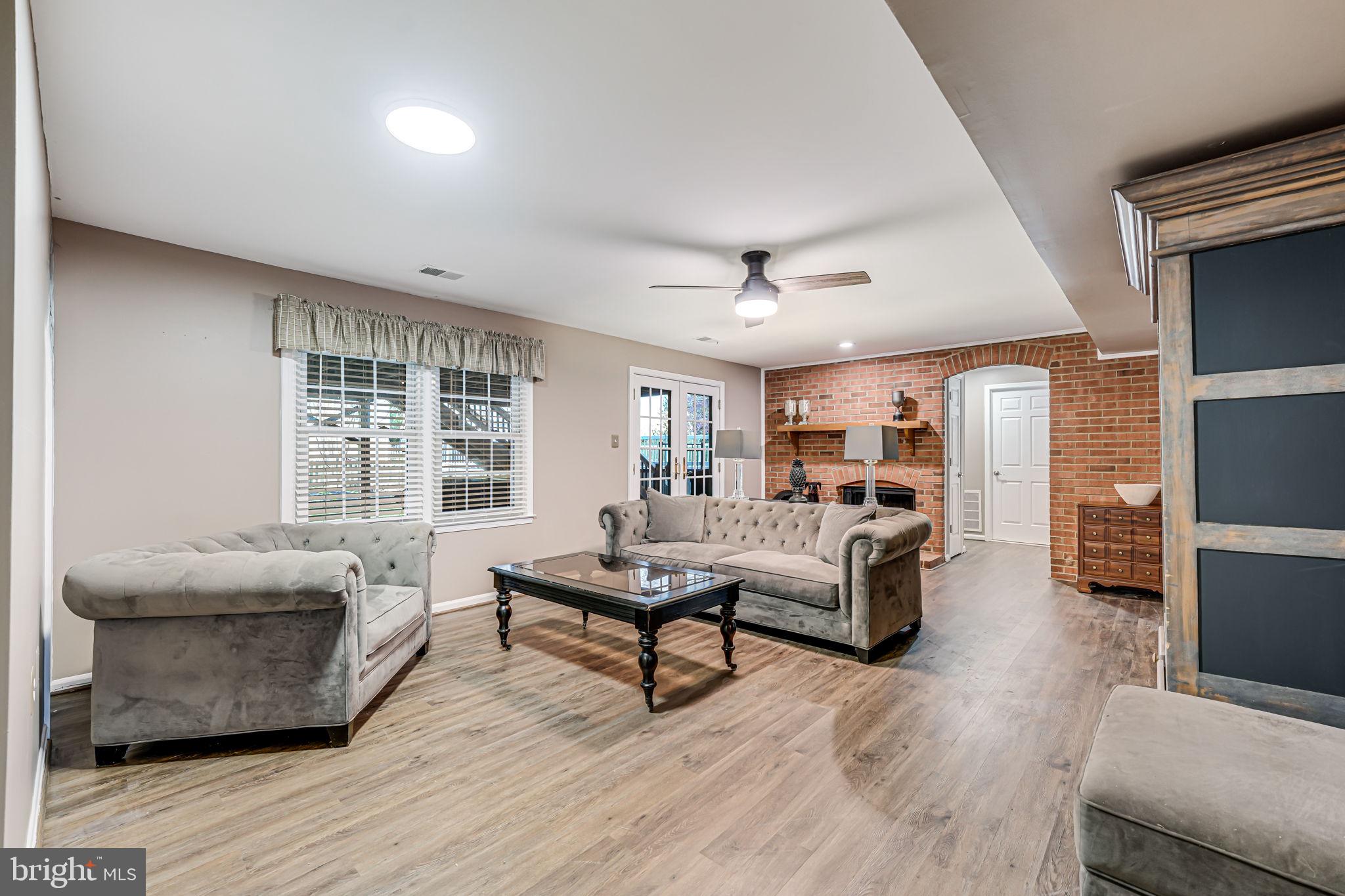 107 Country Road Sterling, VA 20165 - Photo 34 of 58 a living room with furniture and a large window
