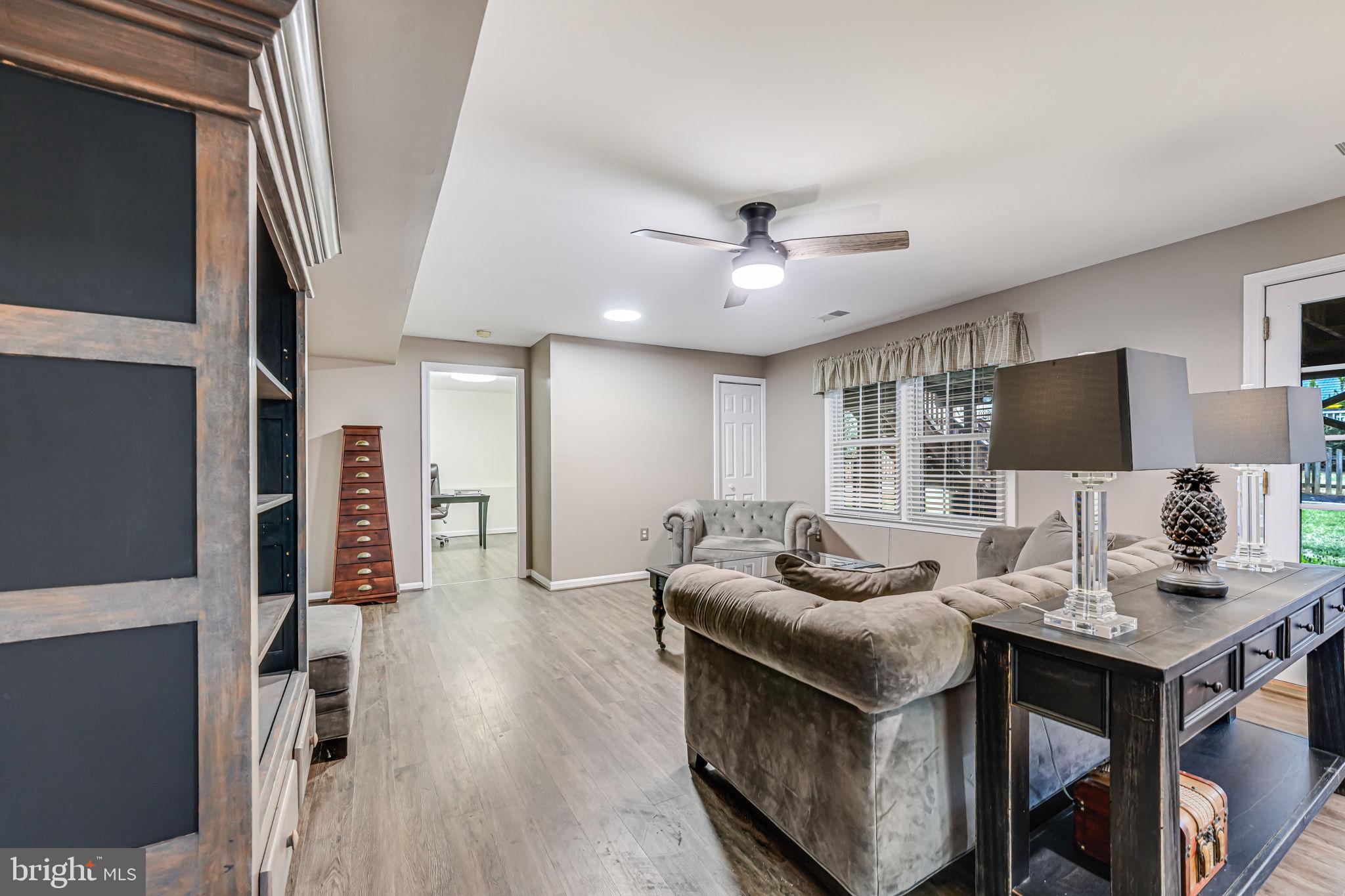 107 Country Road Sterling, VA 20165 - Photo 35 of 58 a living room with furniture and a flat screen tv