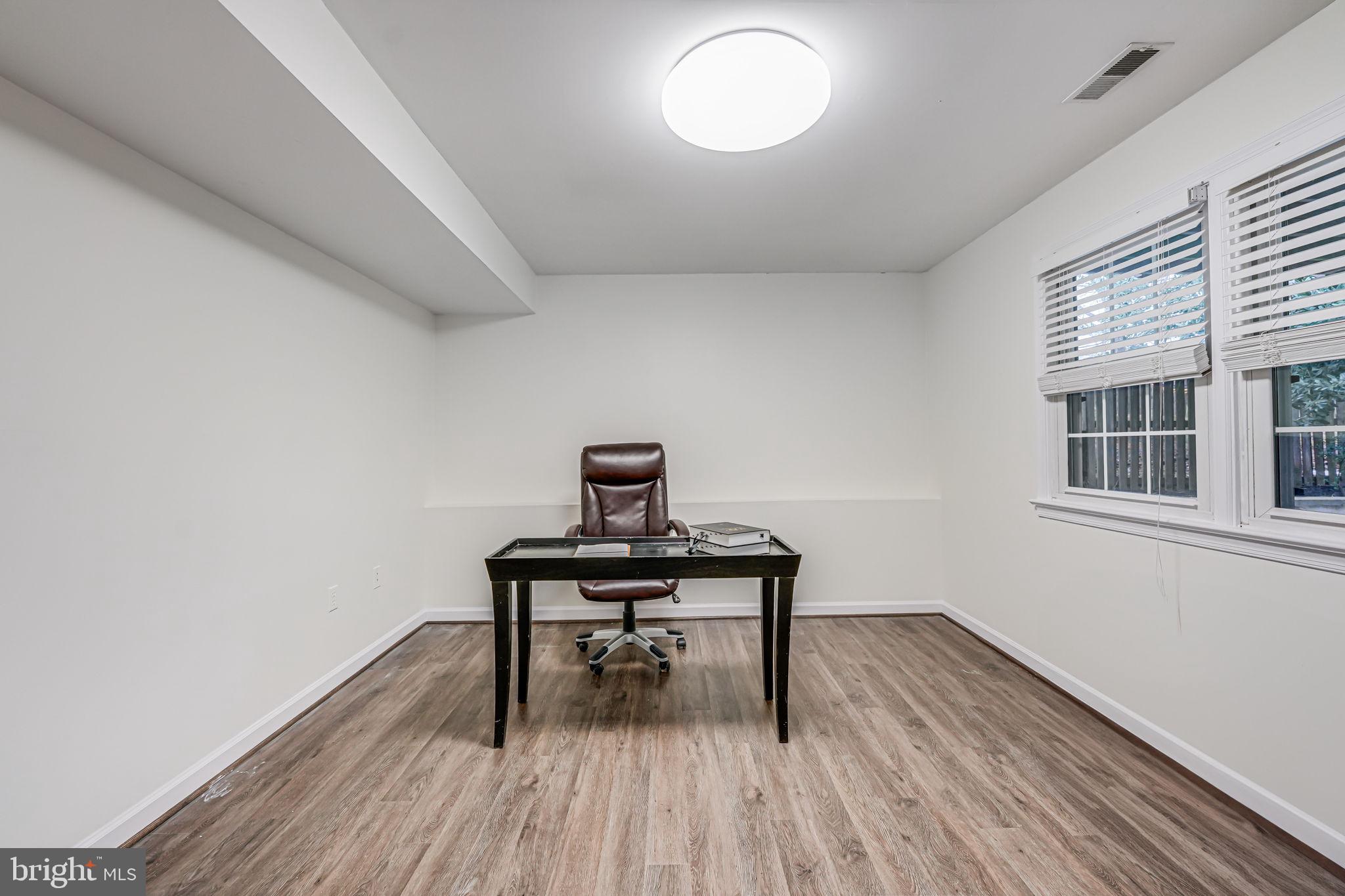 107 Country Road Sterling, VA 20165 - Photo 41 of 58 a view of a workspace with wooden floor