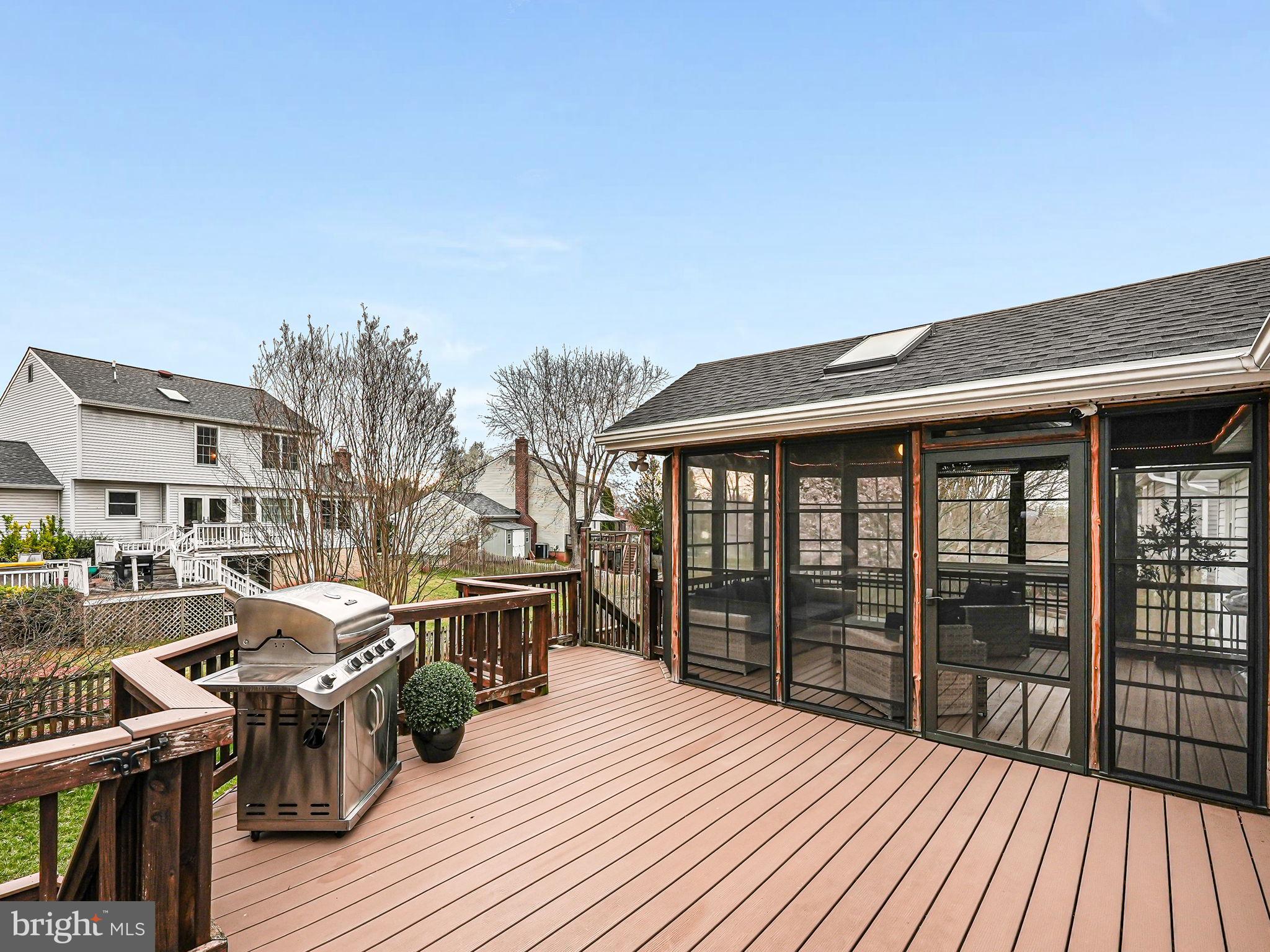 107 Country Road Sterling, VA 20165 - Photo 47 of 58 a balcony with wooden floor table and chairs