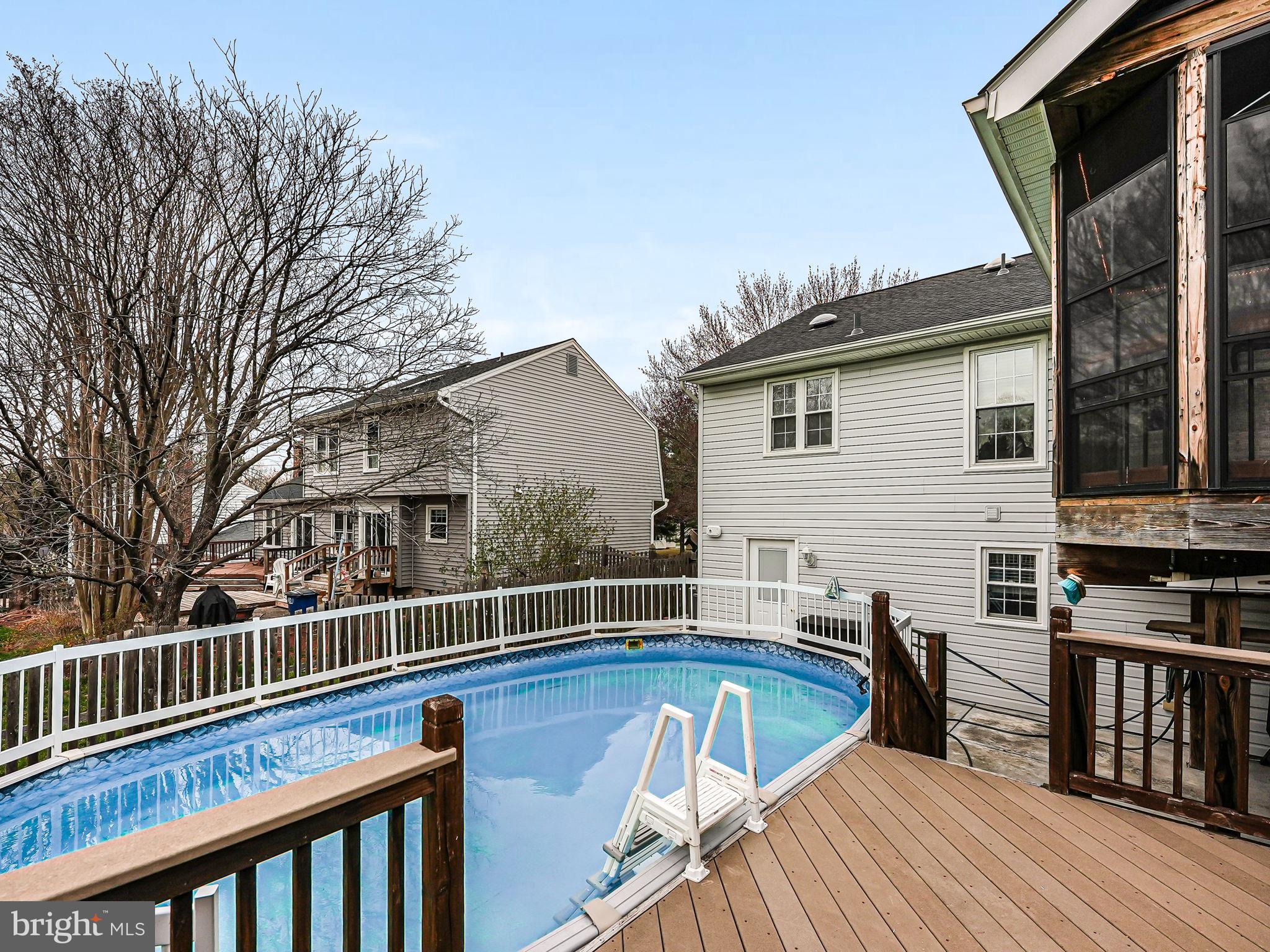 107 Country Road Sterling, VA 20165 - Photo 48 of 58 a view of a house with pool and wooden floor