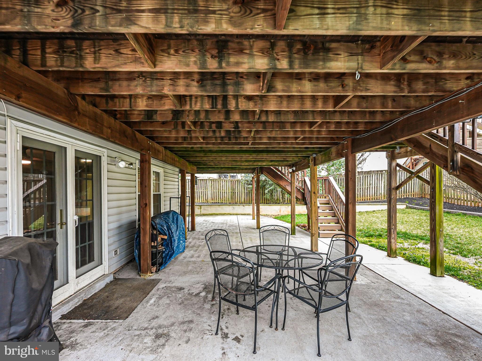 107 Country Road Sterling, VA 20165 - Photo 50 of 58 a dining room with furniture and a floor to ceiling window
