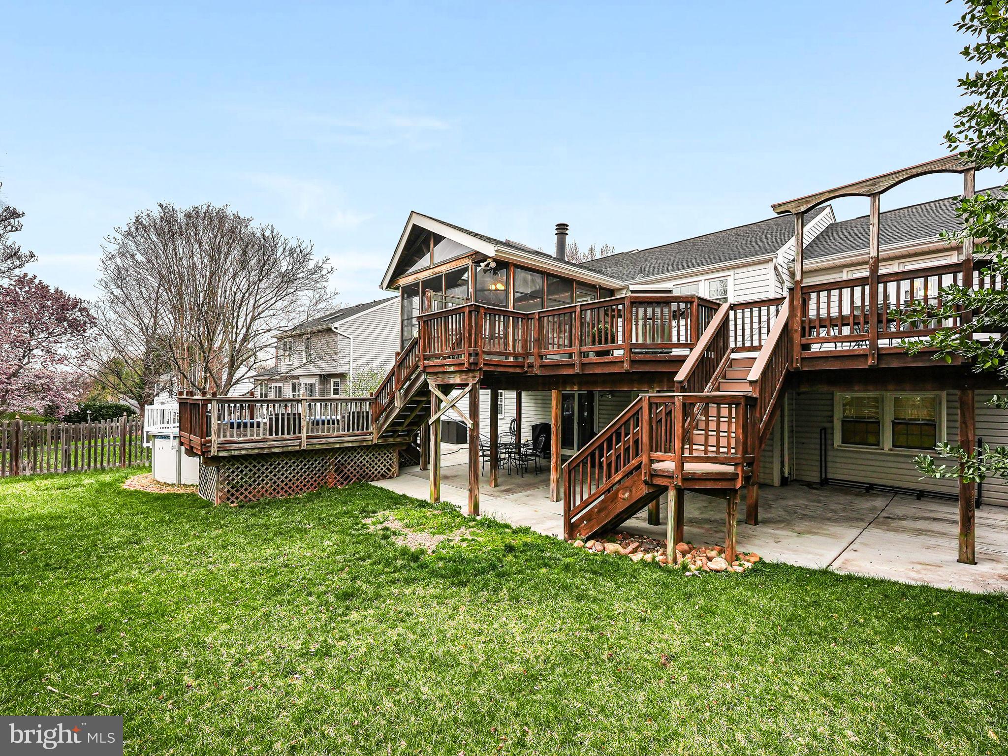 107 Country Road Sterling, VA 20165 - Photo 53 of 58 a view of a house with a yard patio and a wooden deck