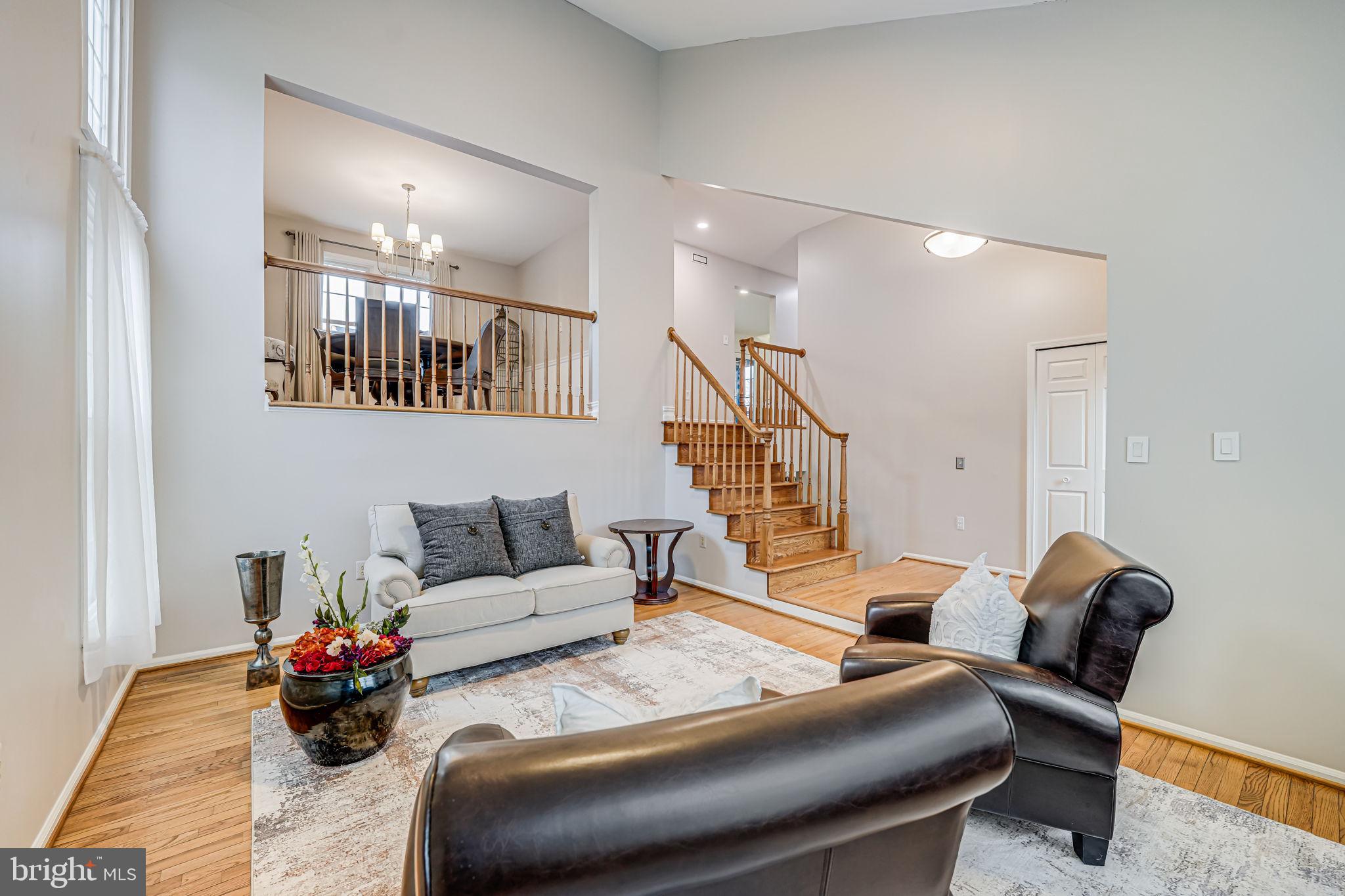 107 Country Road Sterling, VA 20165 - Photo 6 of 58 a living room with furniture and wooden floor