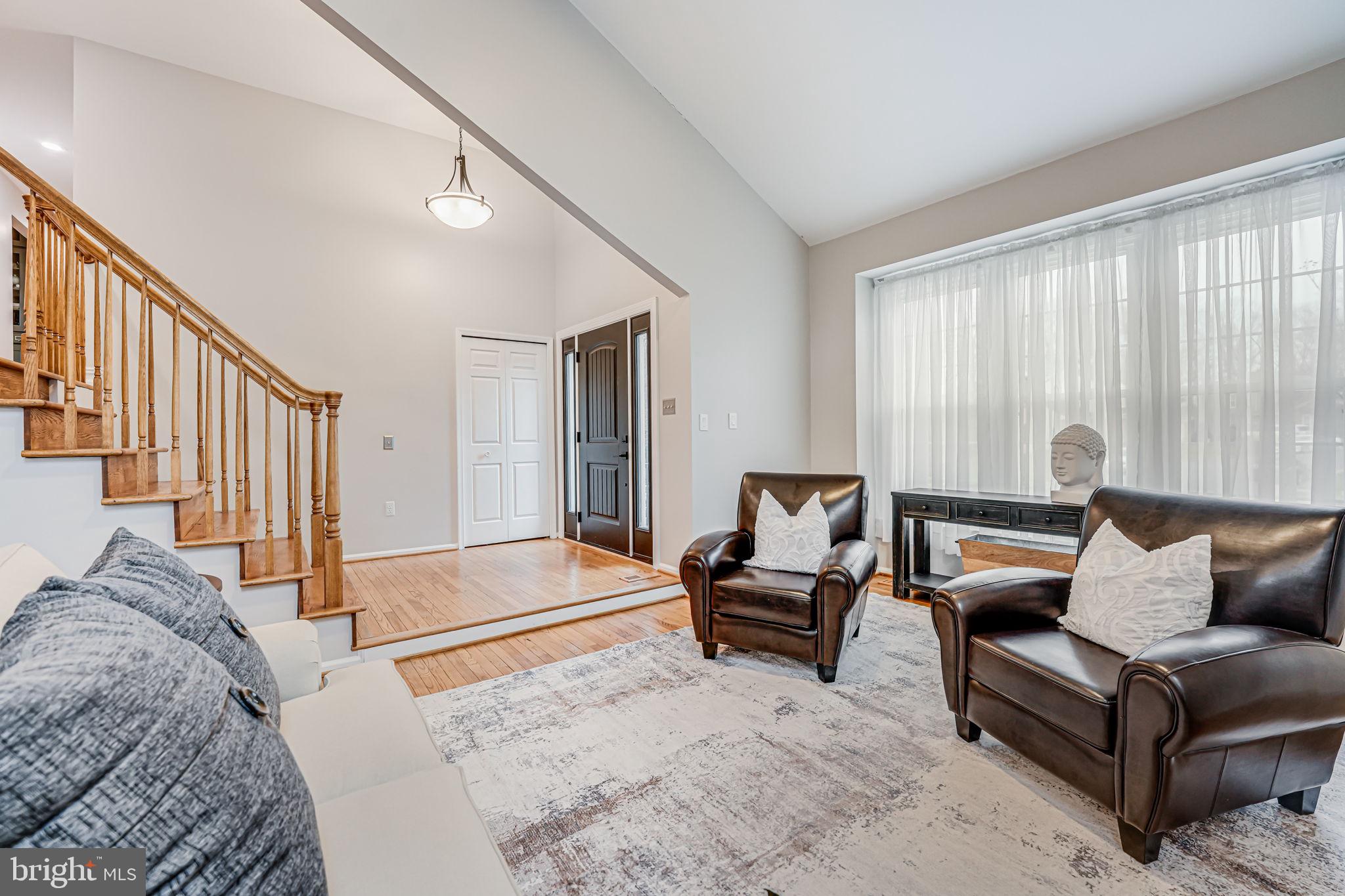 107 Country Road Sterling, VA 20165 - Photo 7 of 58 a living room with furniture and stairs