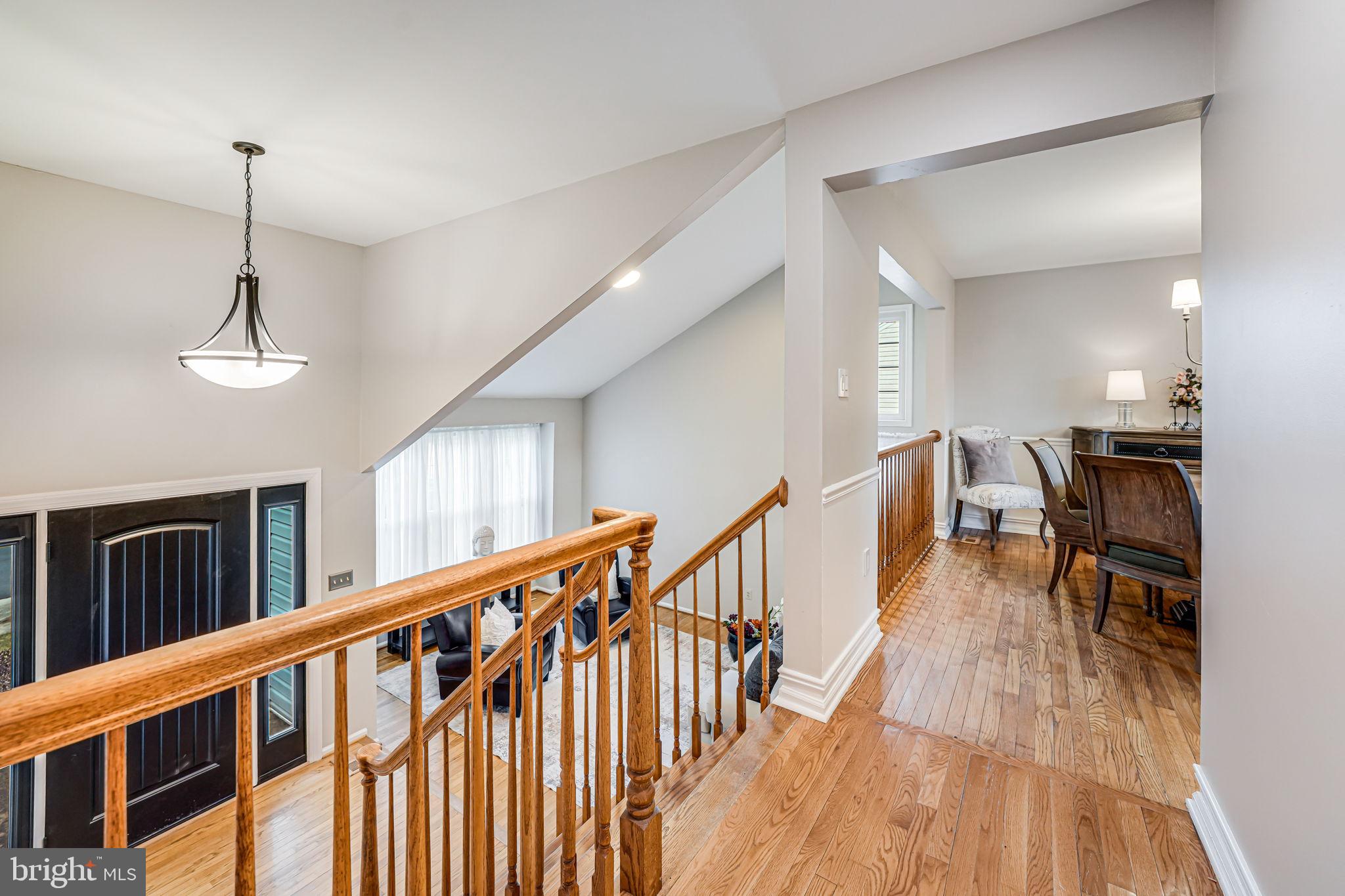107 Country Road Sterling, VA 20165 - Photo 8 of 58 a view of dining room with furniture and wooden floor