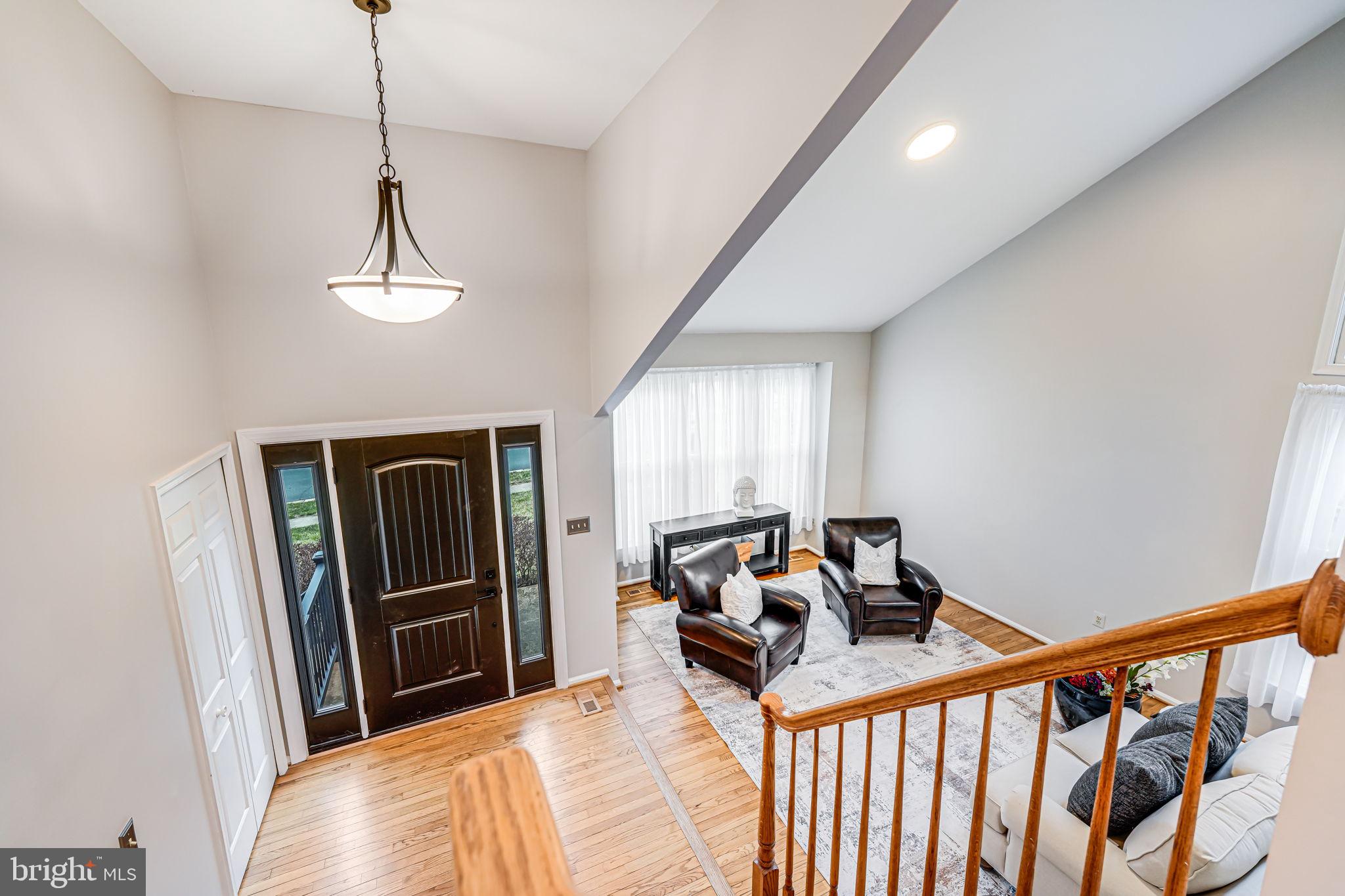 107 Country Road Sterling, VA 20165 - Photo 9 of 58 a bedroom with bed and wooden floor