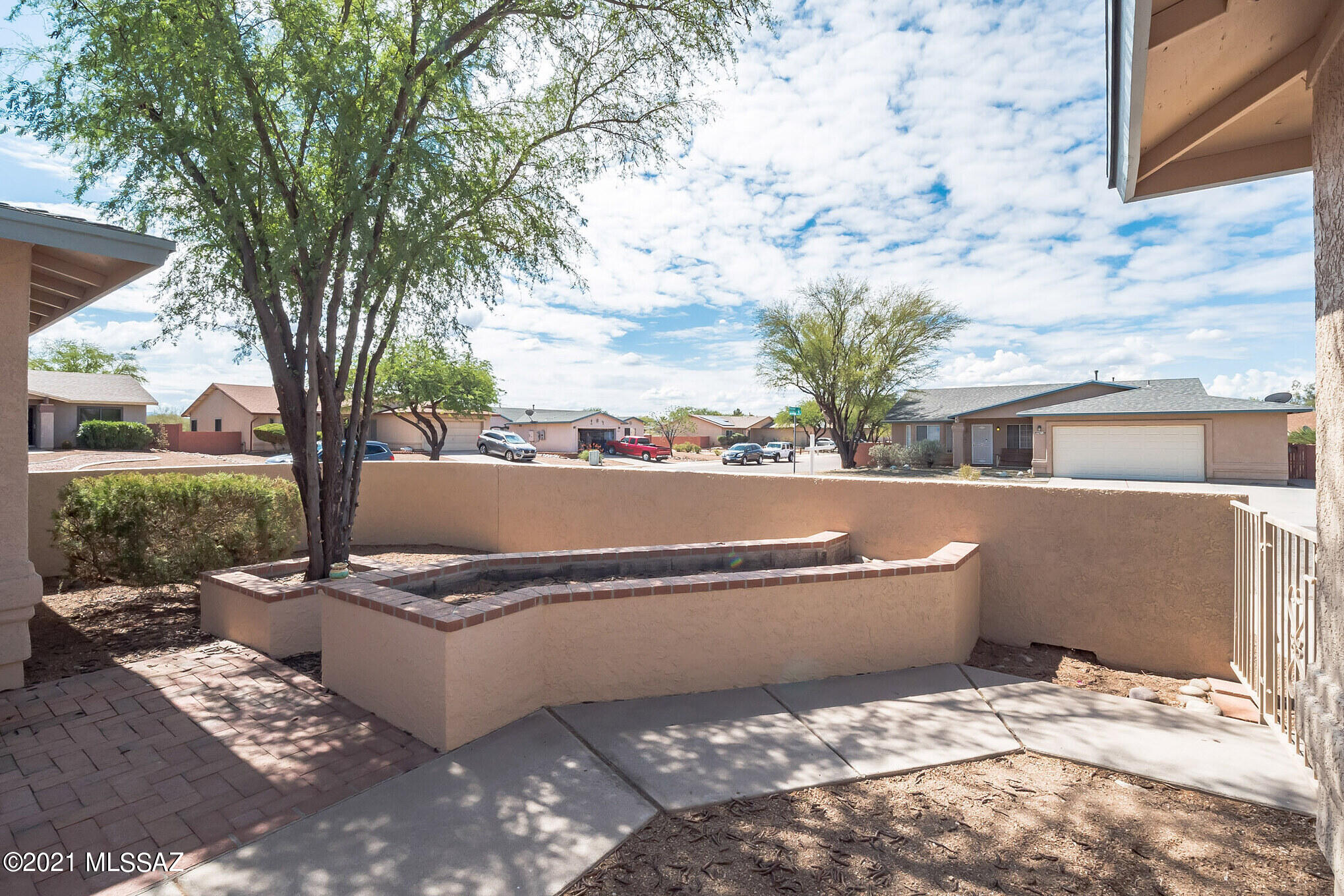 9671 East Azuma Way Tucson, AZ 85747 - Photo 2 of 31 a view of a swimming pool with a patio
