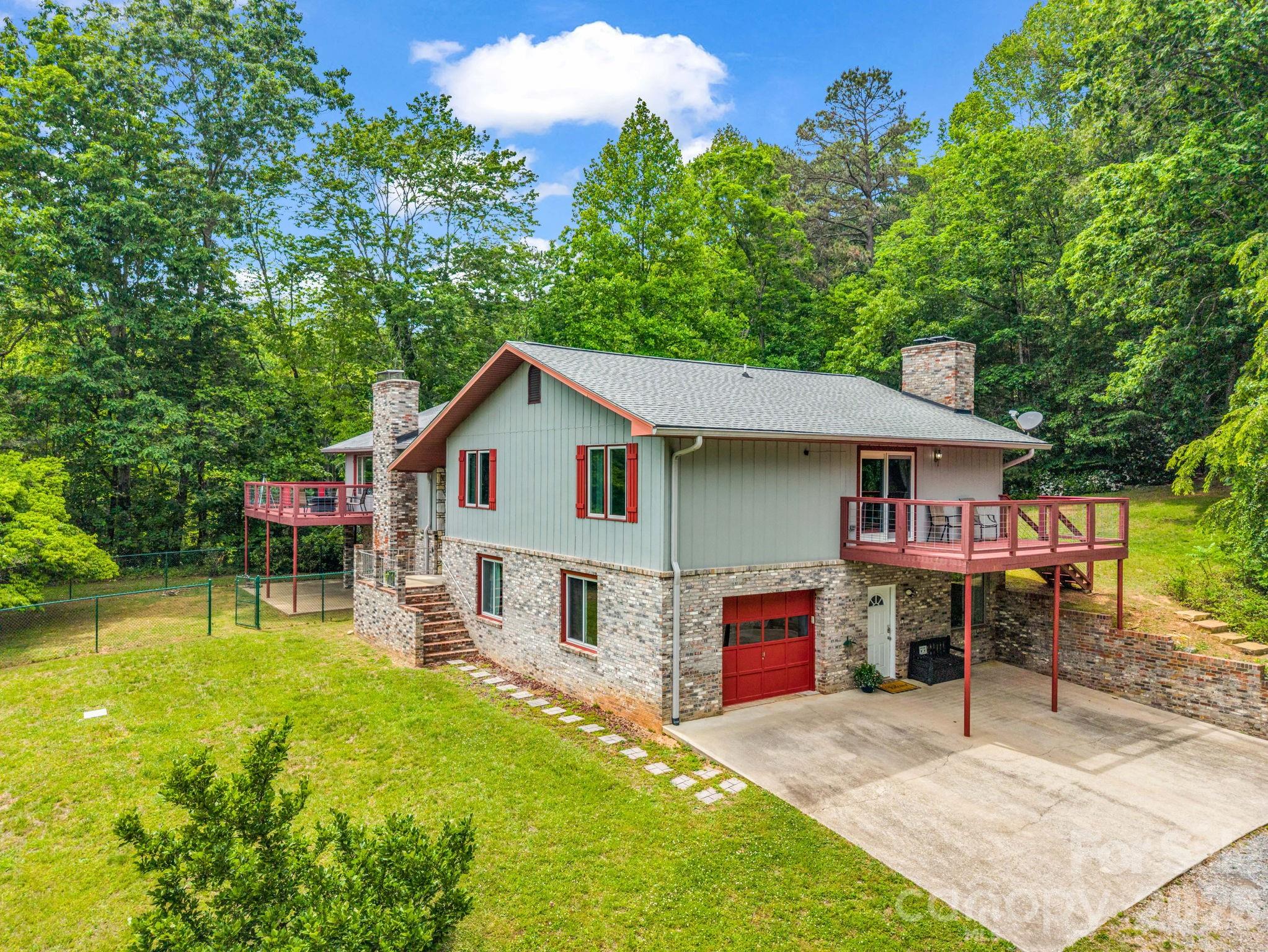 656 Cashiers Valley Road Brevard, NC 28712 - Photo 3 of 37 a house view with a outdoor space