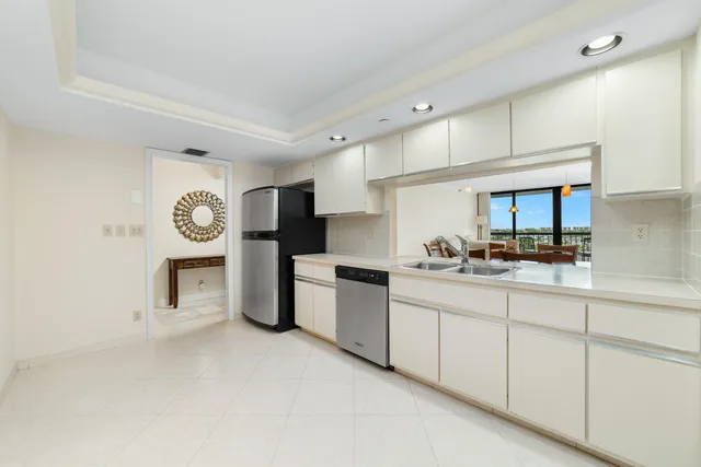 a kitchen with stainless steel appliances granite countertop a sink and cabinets