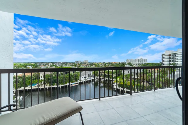 a spacious bedroom with a bed and a flat screen television