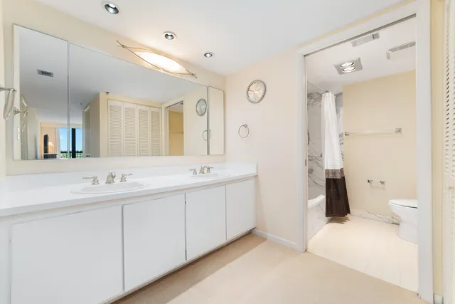 a bathroom with a toilet and shower