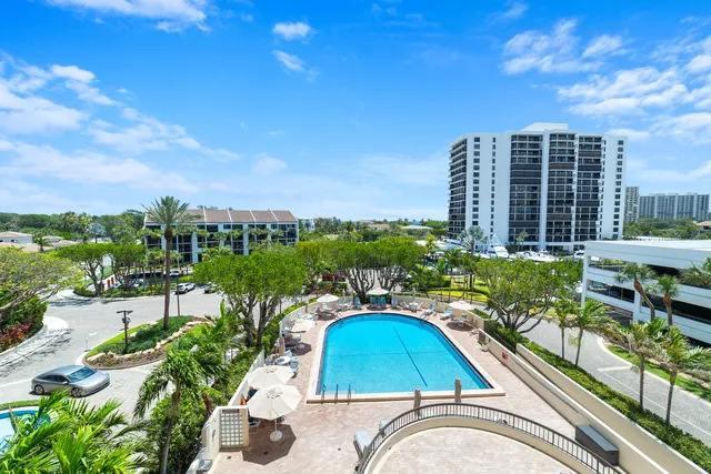 a view of a swimming pool with a lounge chairs