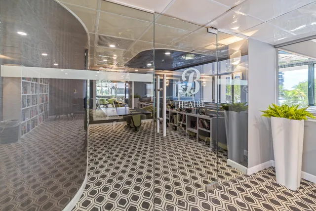 a dining room with furniture a chandelier and fireplace