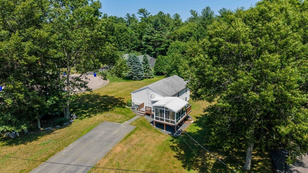 8 Cotuit Road Taunton, MA 02718 - Photo 6 of 24 an aerial view of a house with swimming pool and large trees