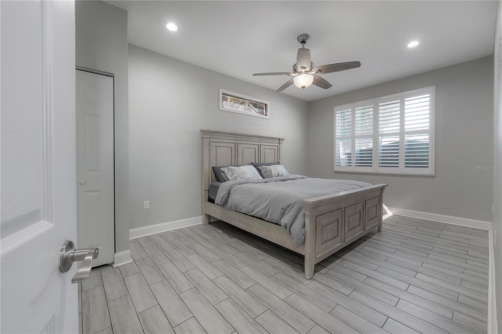 2341 West Chestnut Street Tampa, FL 33607 - Photo 16 of 42 a bedroom with a bed and window