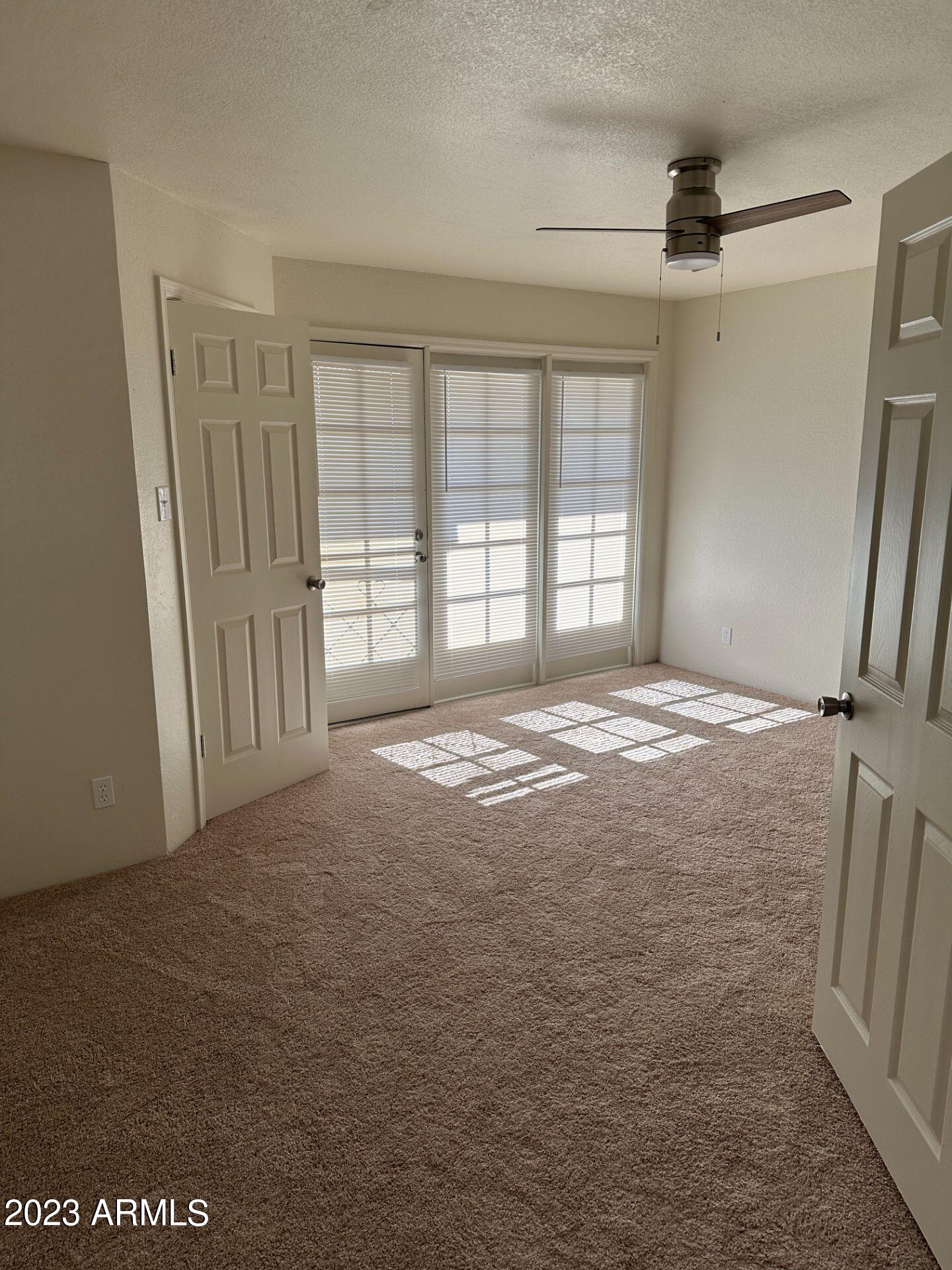 2121 West Union Hills Drive, Unit 108 Phoenix, AZ 85027 - Photo 13 of 35 a view of an empty room with a window