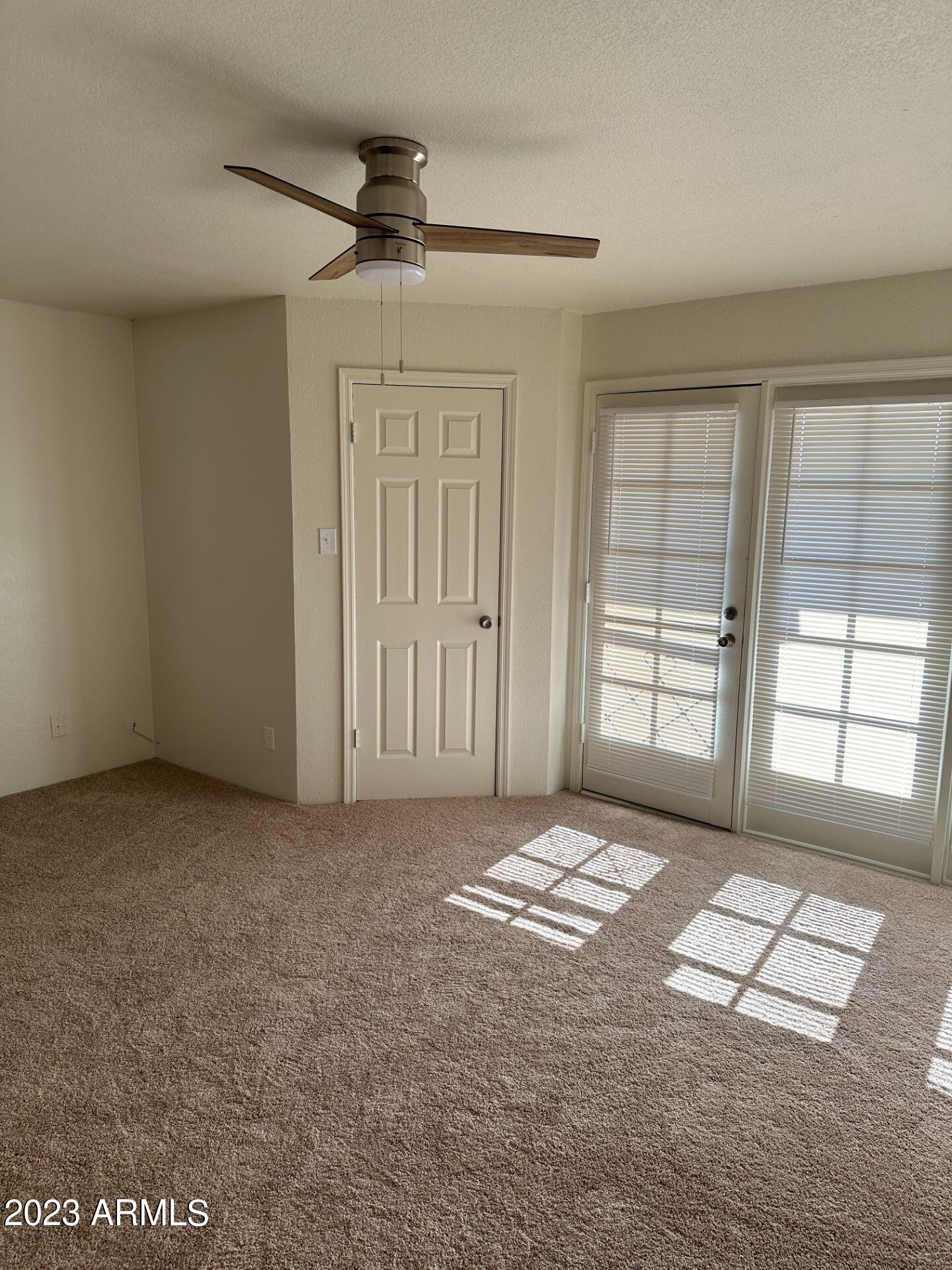 2121 West Union Hills Drive, Unit 108 Phoenix, AZ 85027 - Photo 14 of 35 an empty room with windows