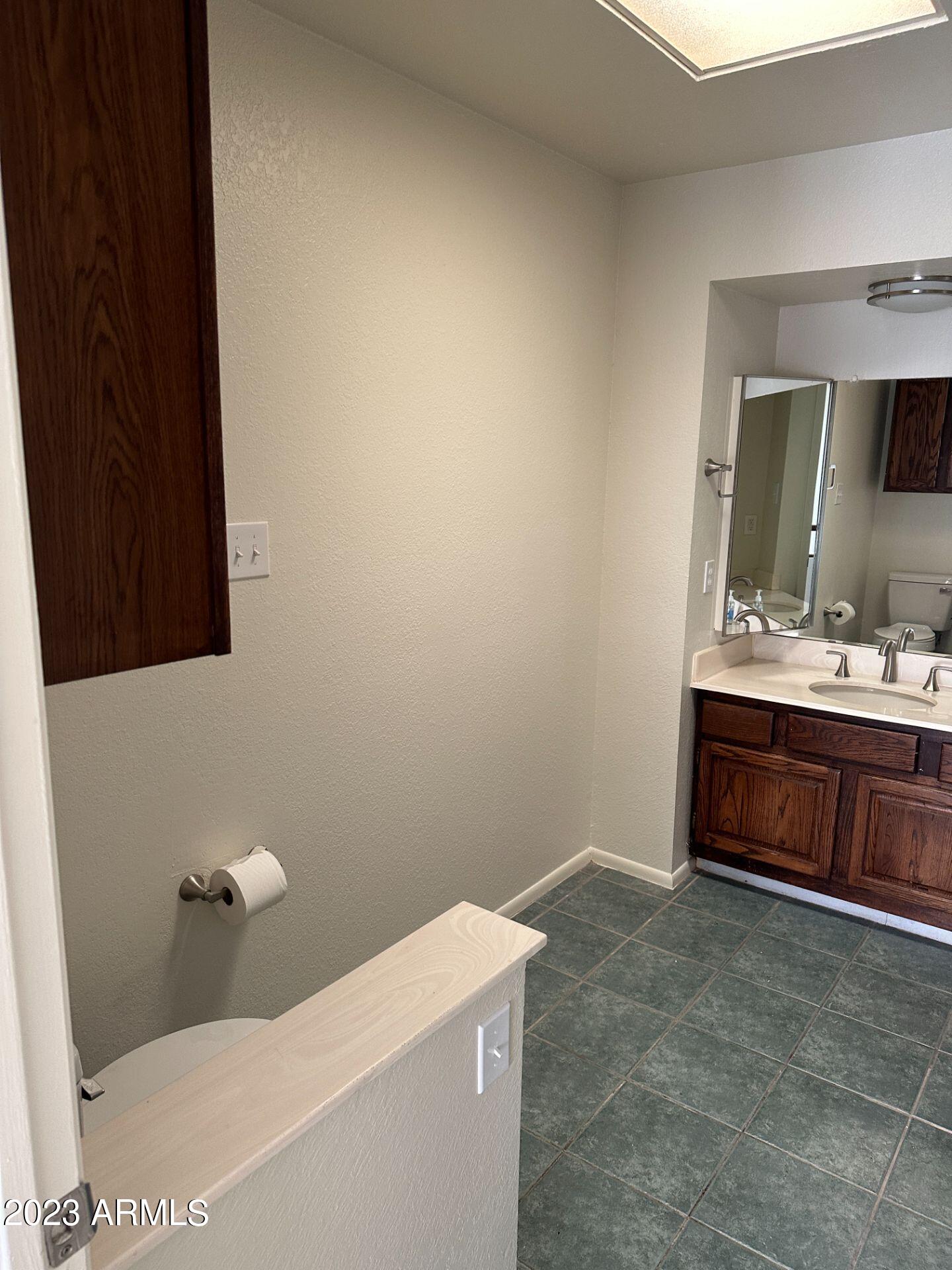 2121 West Union Hills Drive, Unit 108 Phoenix, AZ 85027 - Photo 16 of 35 a bathroom with a sink and a mirror