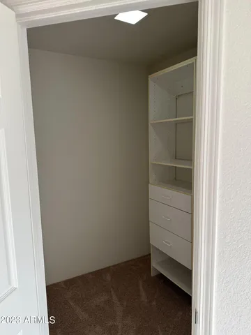 a view of an empty walk in closet