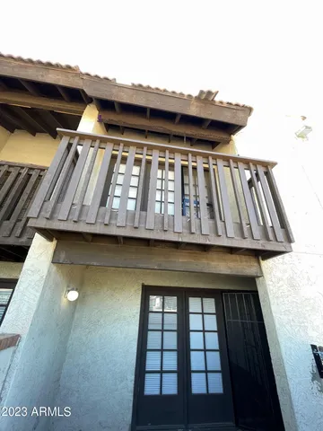 a view of balcony with a small yard