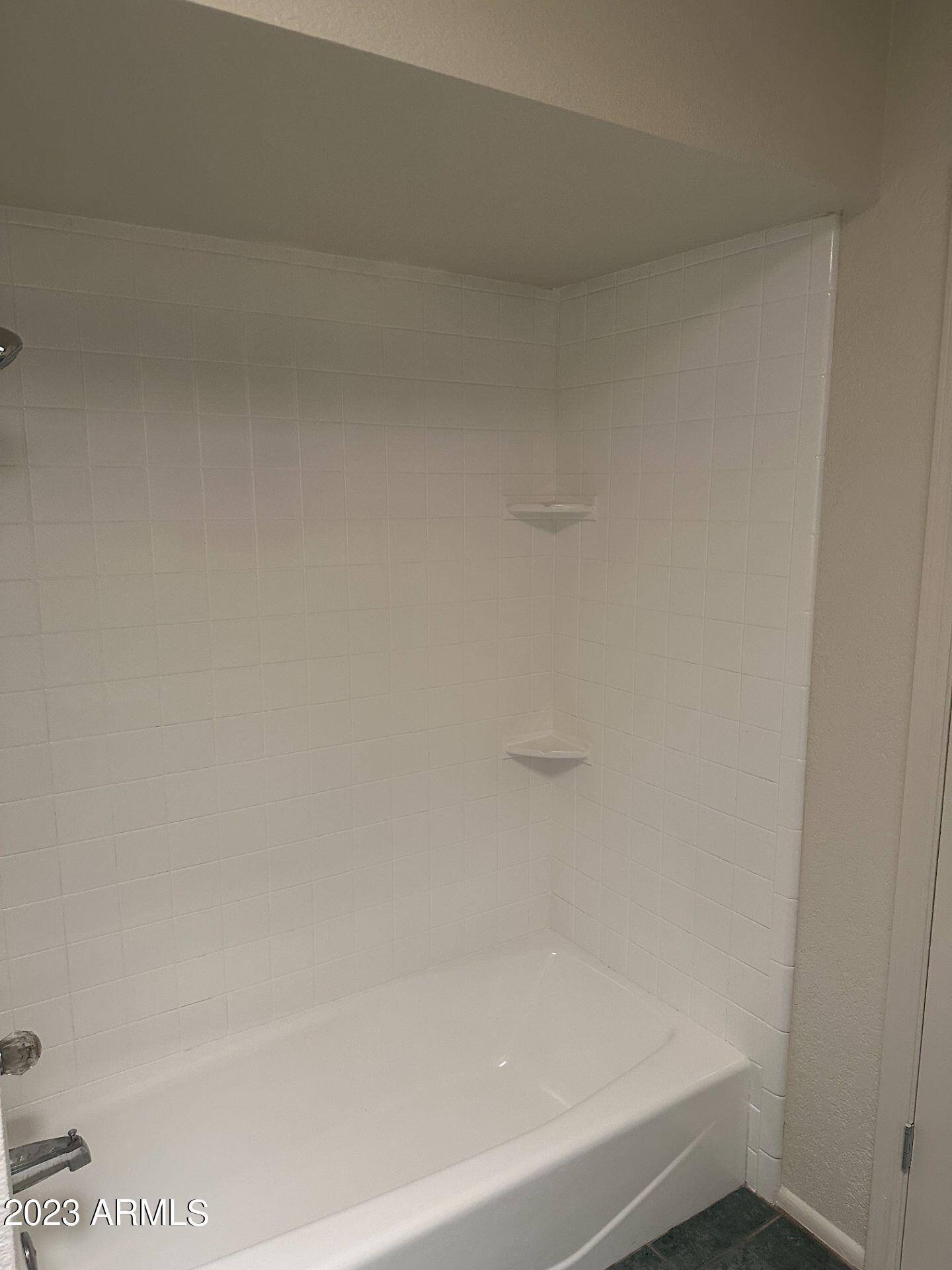 2121 West Union Hills Drive, Unit 108 Phoenix, AZ 85027 - Photo 22 of 35 a bathroom with a bathtub