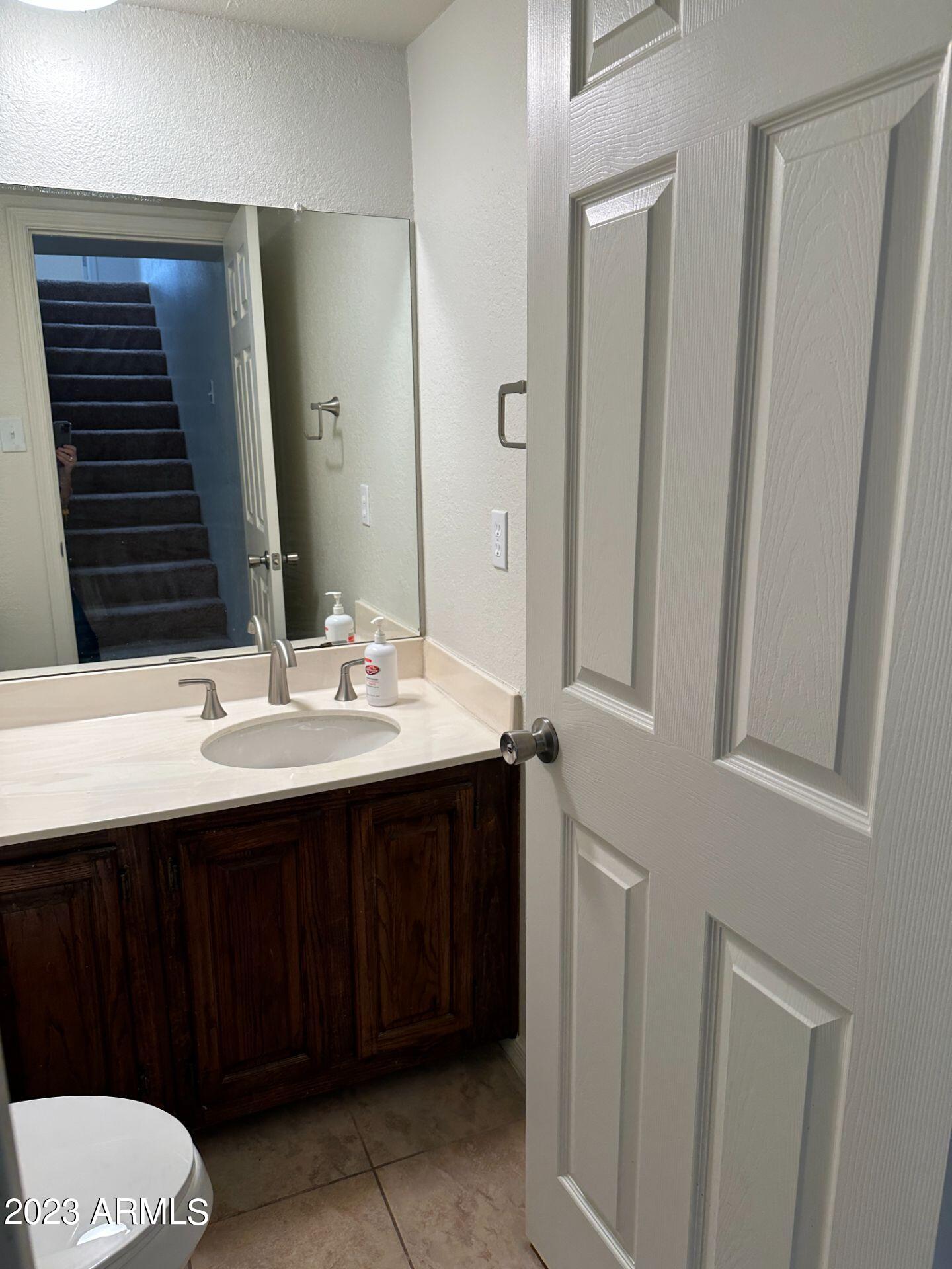 2121 West Union Hills Drive, Unit 108 Phoenix, AZ 85027 - Photo 23 of 35 a bathroom with a sink and a mirror