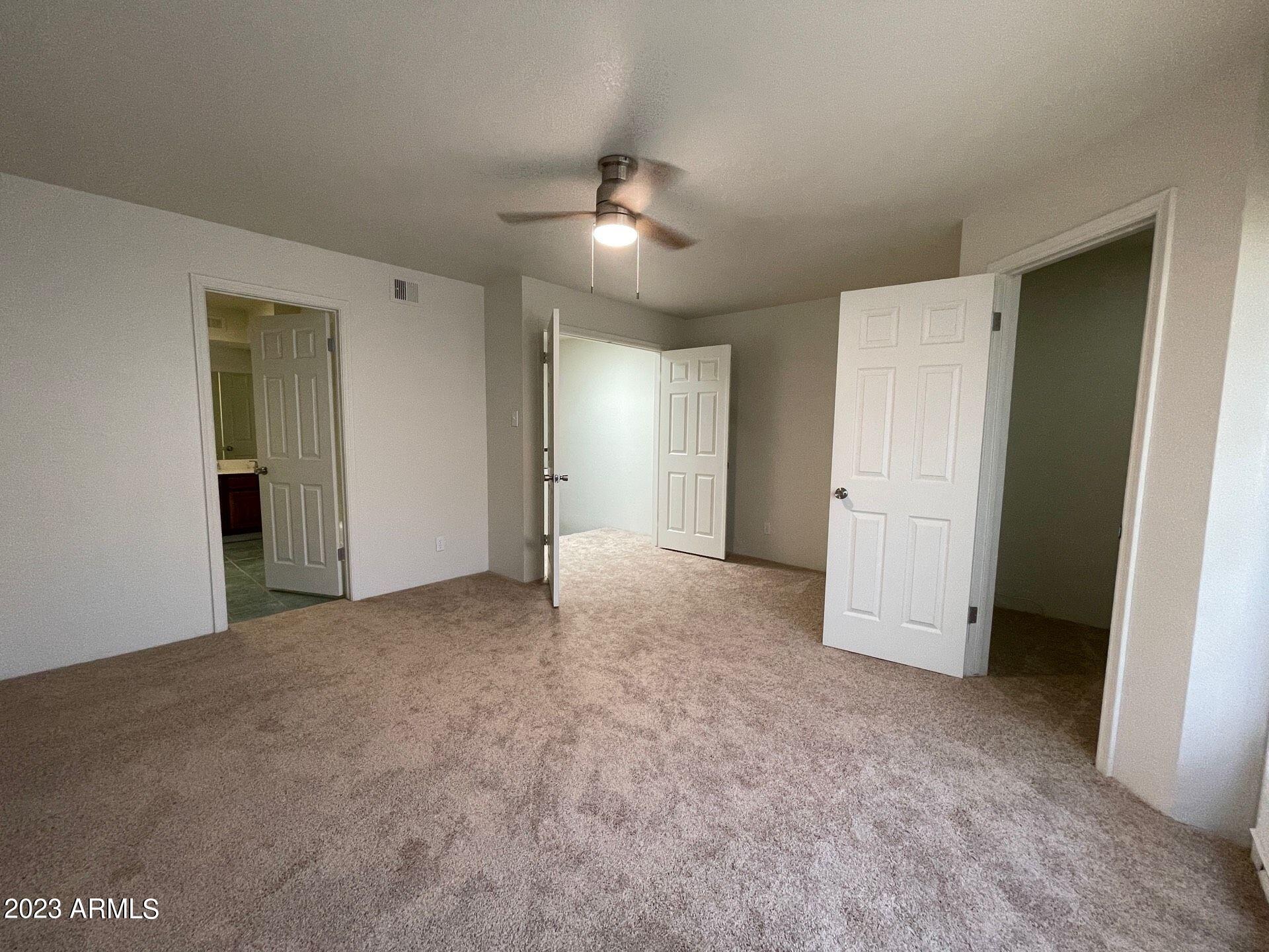 2121 West Union Hills Drive, Unit 108 Phoenix, AZ 85027 - Photo 24 of 35 a view of a livingroom with an empty space