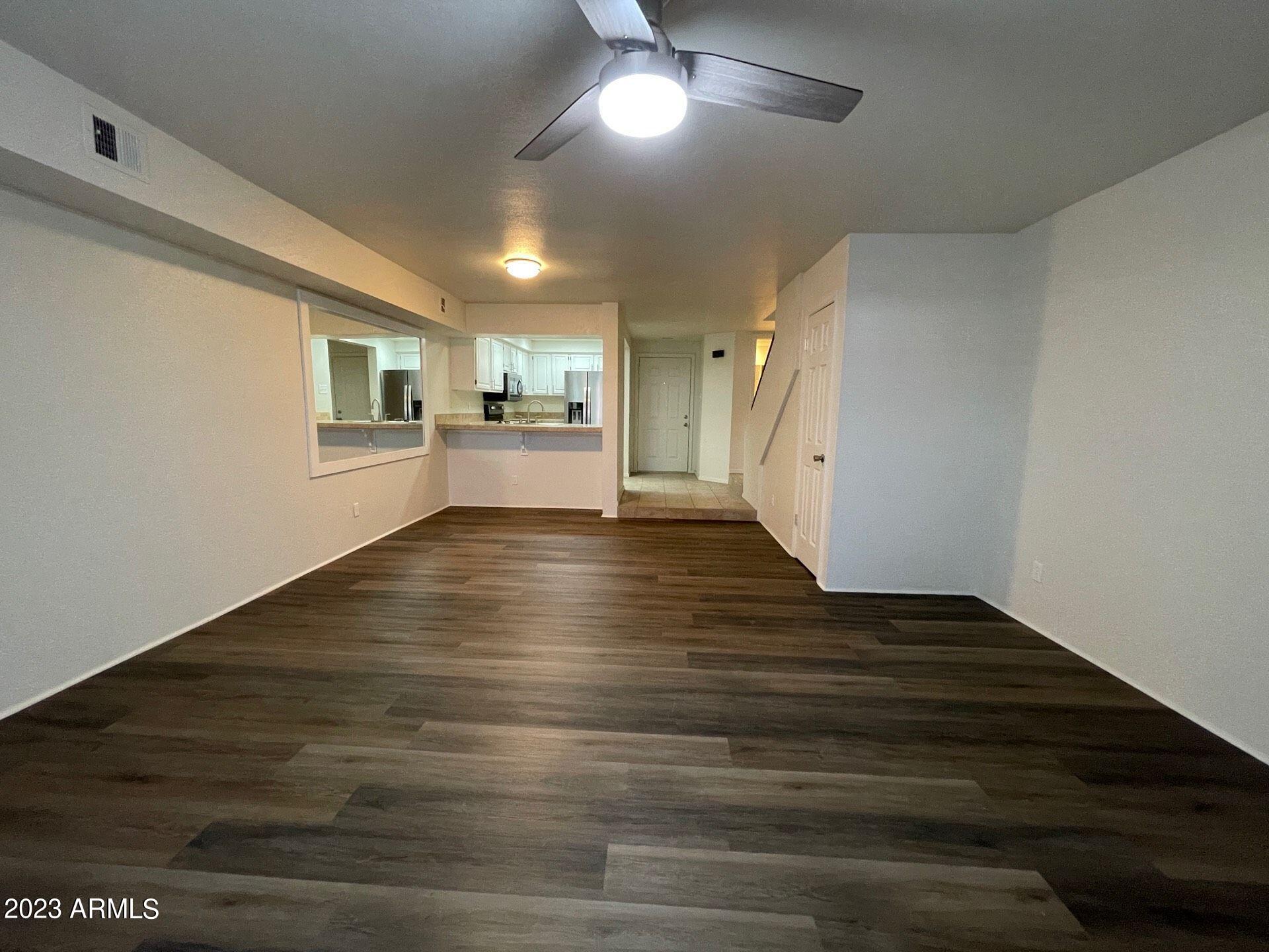 2121 West Union Hills Drive, Unit 108 Phoenix, AZ 85027 - Photo 28 of 35 a view of empty room with wooden floor