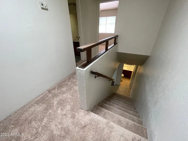 a view of a balcony with wooden floor
