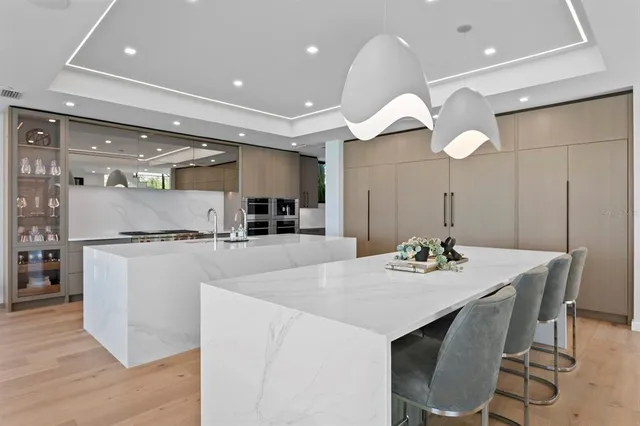 a bedroom with a large bed and a flat screen tv