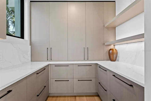 a utility room with sink dryer and washer