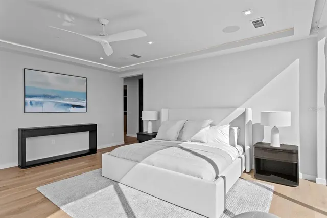 a living room with furniture a flat screen tv and a large window