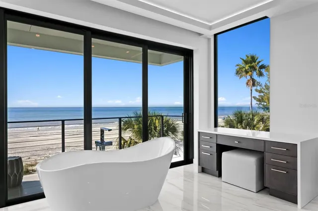 a bathroom with a bathtub and shower