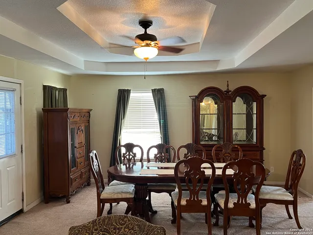 a view of a dining room with furniture